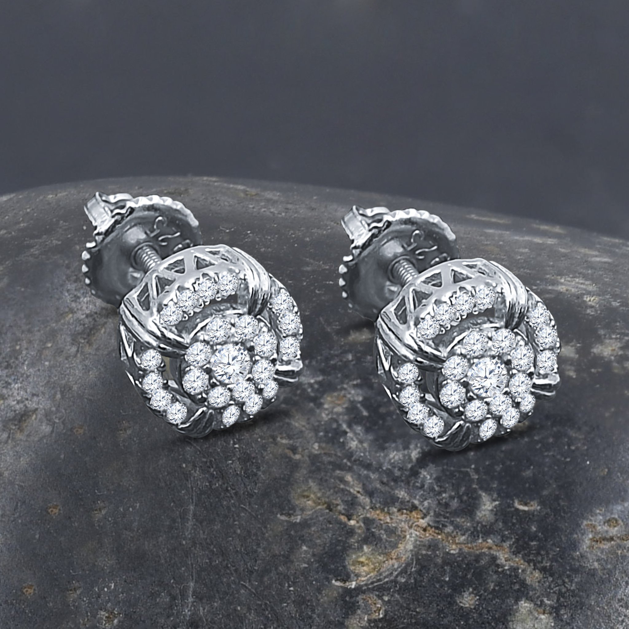 A pair of elegant FLAIR Silver Earrings featuring cubic zircon stones set in 925 sterling silver, showcasing a unique design.