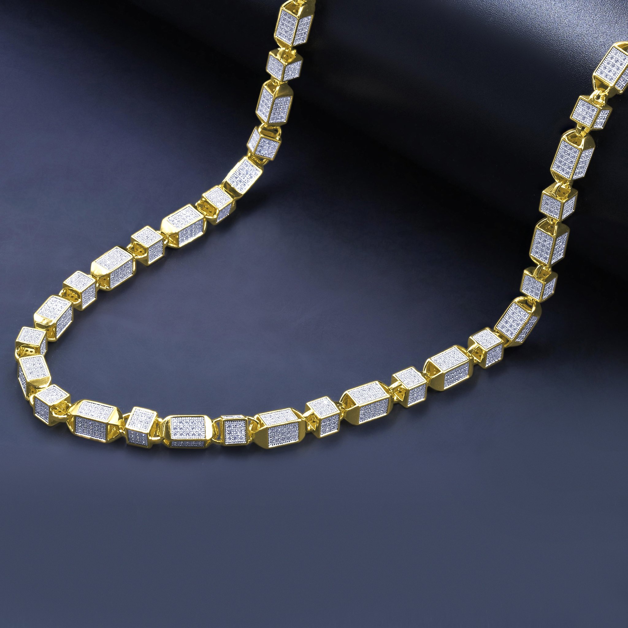 Flamboyant CZ Chain featuring rectangular cubic zirconia stones set in brass metal with rhodium and gold plating options.