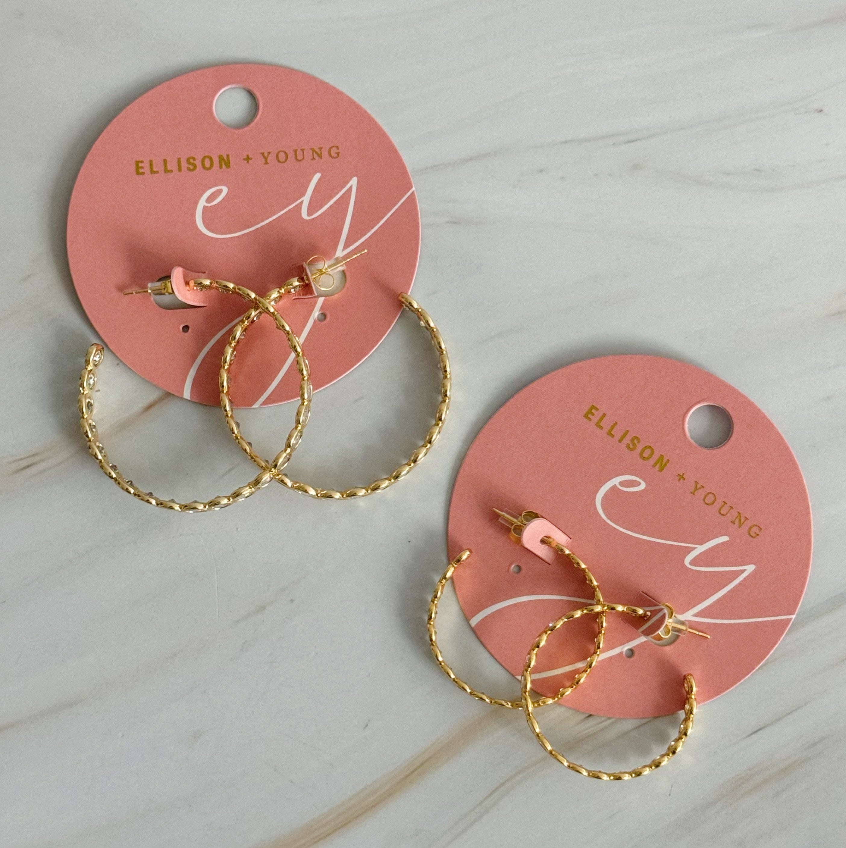 Elegant Floating Bezel Crystal Hoop Earrings with sparkling cubic zirconia set in 18K gold plated brass, showcasing a stylish design.