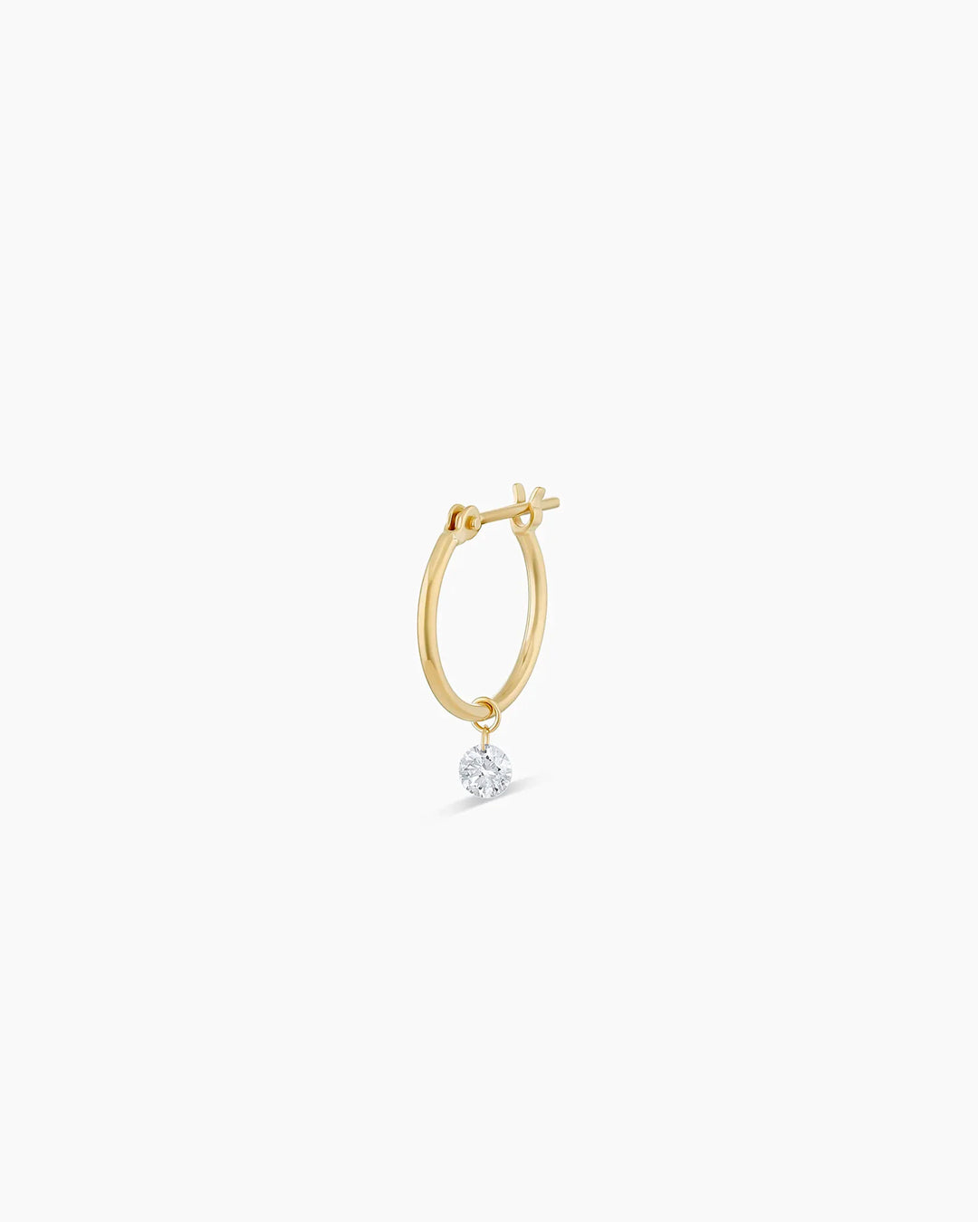 Elegant 14k gold Floating Diamond Huggie earrings featuring sparkling floating diamonds, perfect for layering.