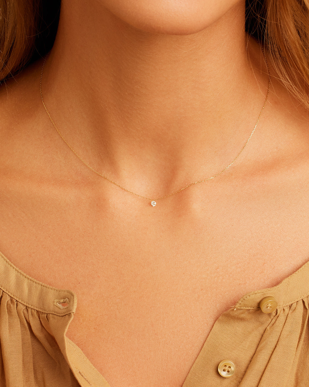 A stunning Floating Diamond Necklace featuring a single lab-grown diamond in a unique floating design, showcasing elegance and sophistication.