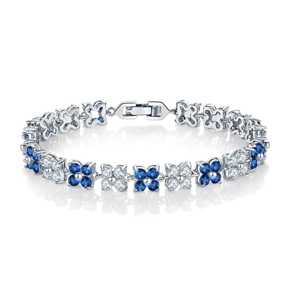 Elegant Flower Cubic Zirconia Tennis Bracelet featuring round-cut blue sapphire and white diamond stones set in 18k white gold plating.