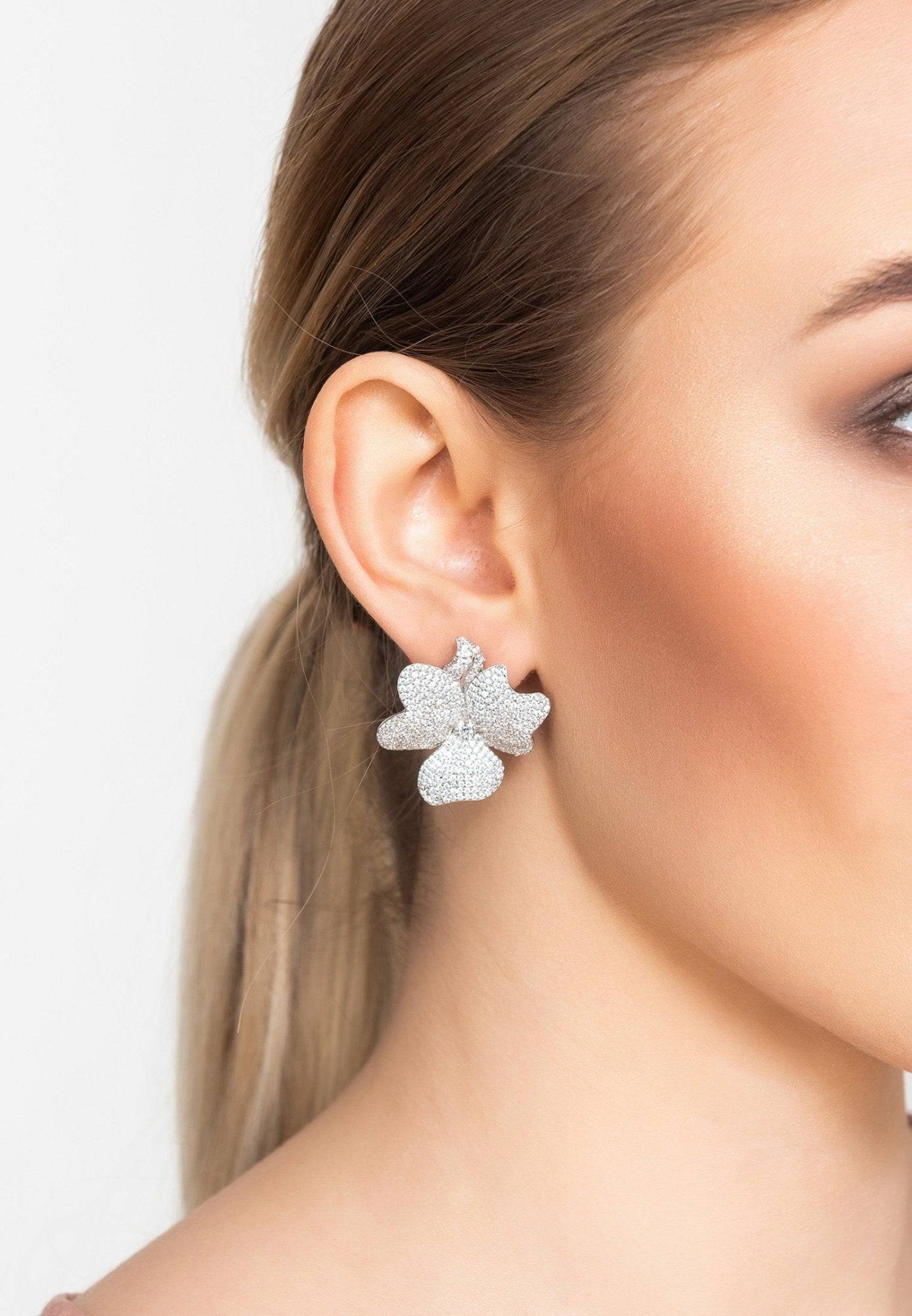 Elegant Flower Large Stud Earrings in silver with sparkling cubic zirconia stones, showcasing a floral design.
