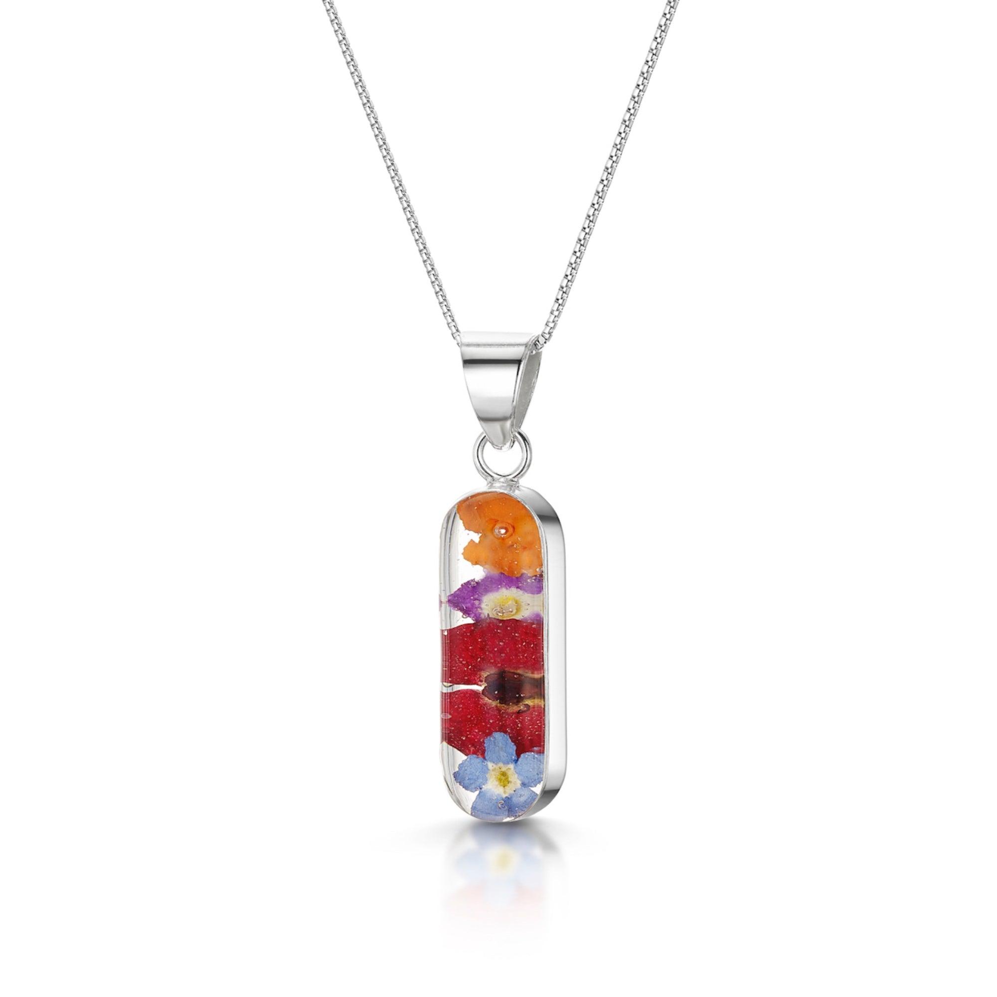 Elegant Flower Necklace by Shrieking Violet® featuring a vertical bar pendant filled with real dried flowers, on a sterling silver chain.