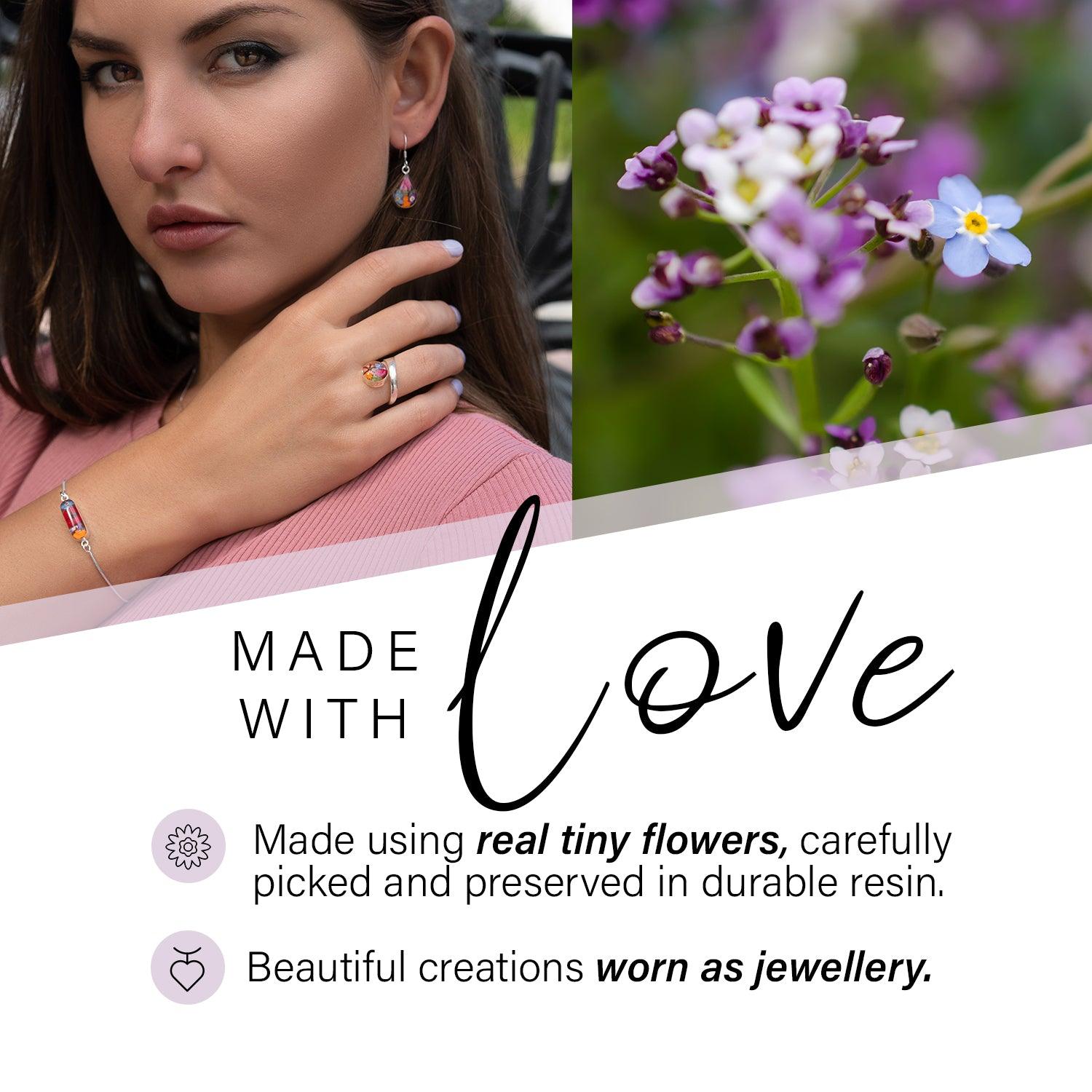 Elegant Flower Necklace by Shrieking Violet® featuring a vertical bar pendant filled with real dried flowers, on a sterling silver chain.