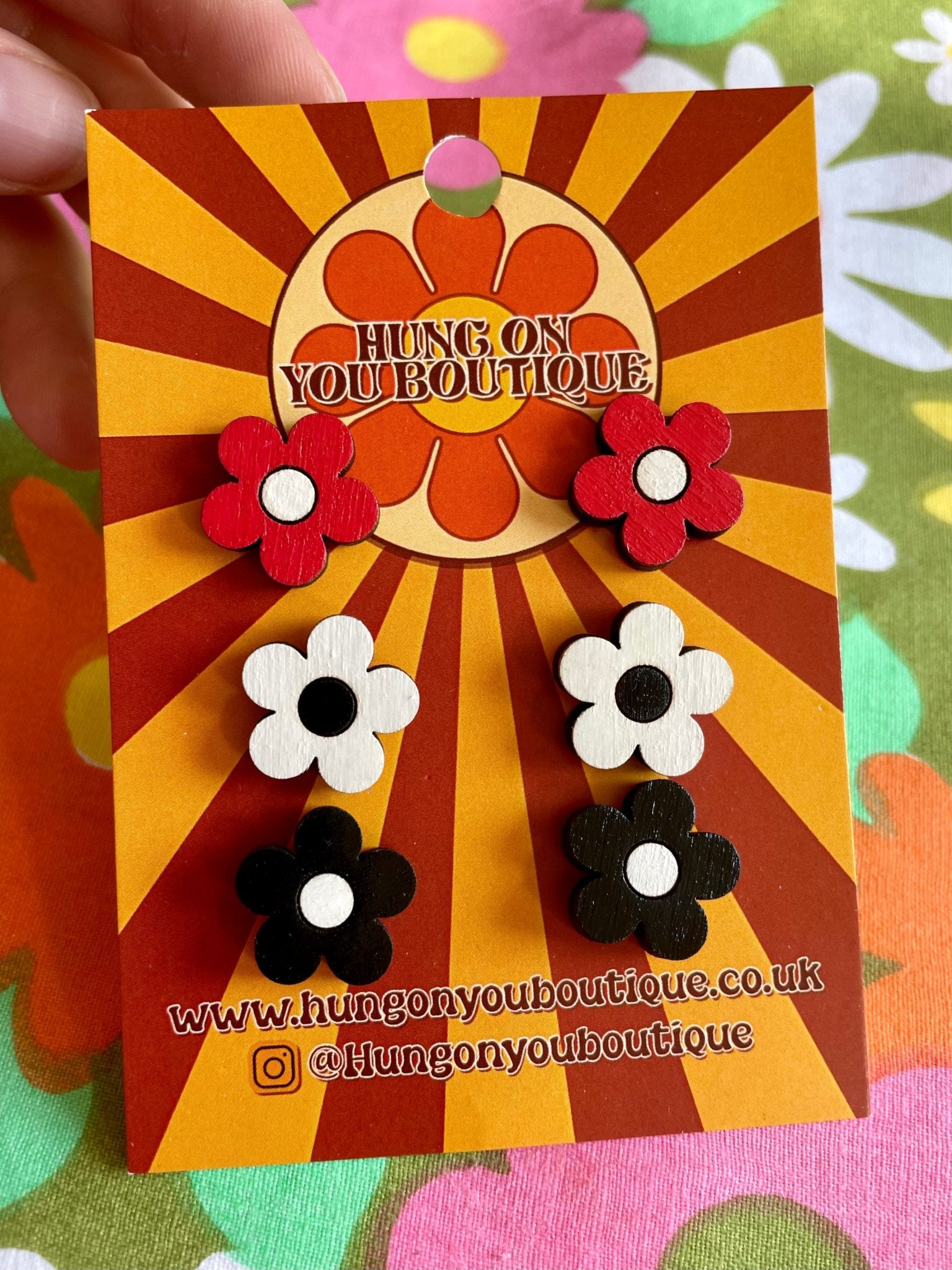 A vibrant collection of Flower Studs 3 Pack featuring colorful flower designs made from sustainable Birch Plywood.