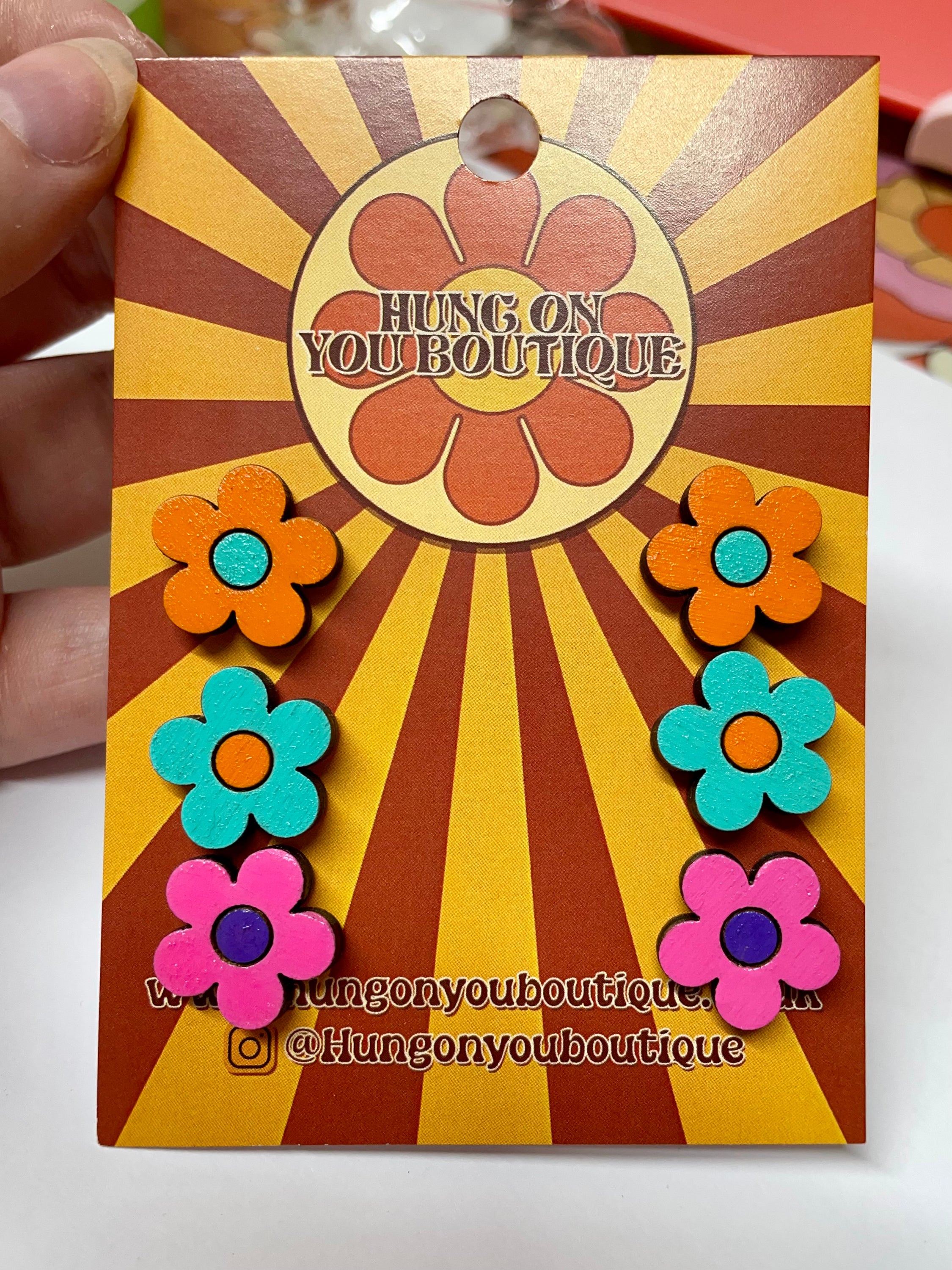 A vibrant collection of Flower Studs 3 Pack featuring colorful flower designs made from sustainable Birch Plywood.