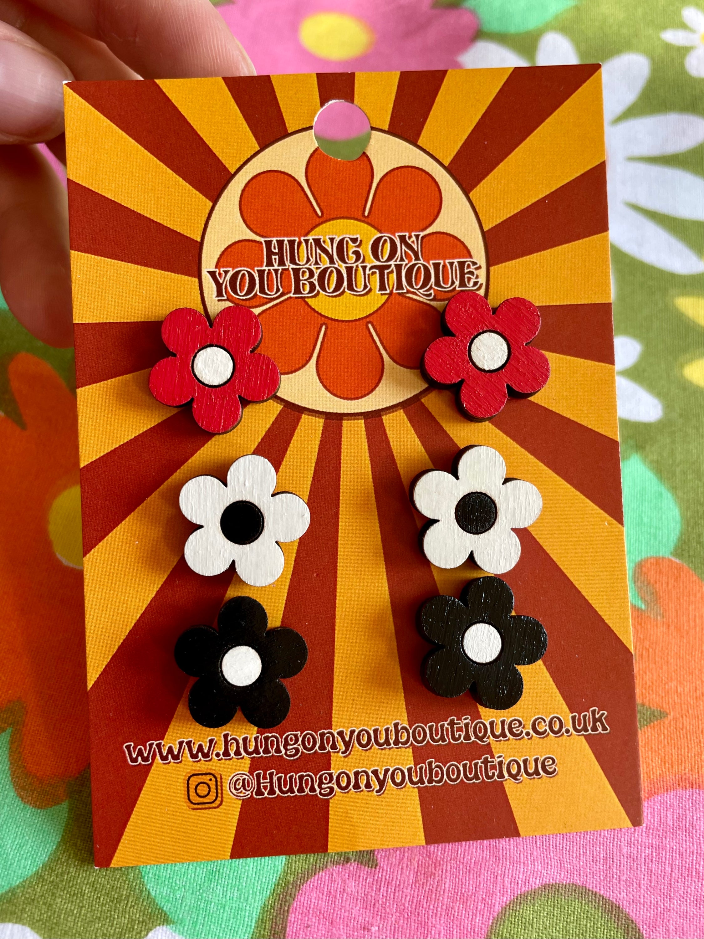 A vibrant collection of Flower Studs 3 Pack featuring colorful flower designs made from sustainable Birch Plywood.