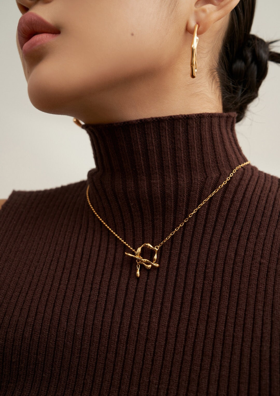 Fluid Way Of Water Necklace featuring a gold vermeil pendant and chain, showcasing its elegant design and craftsmanship.