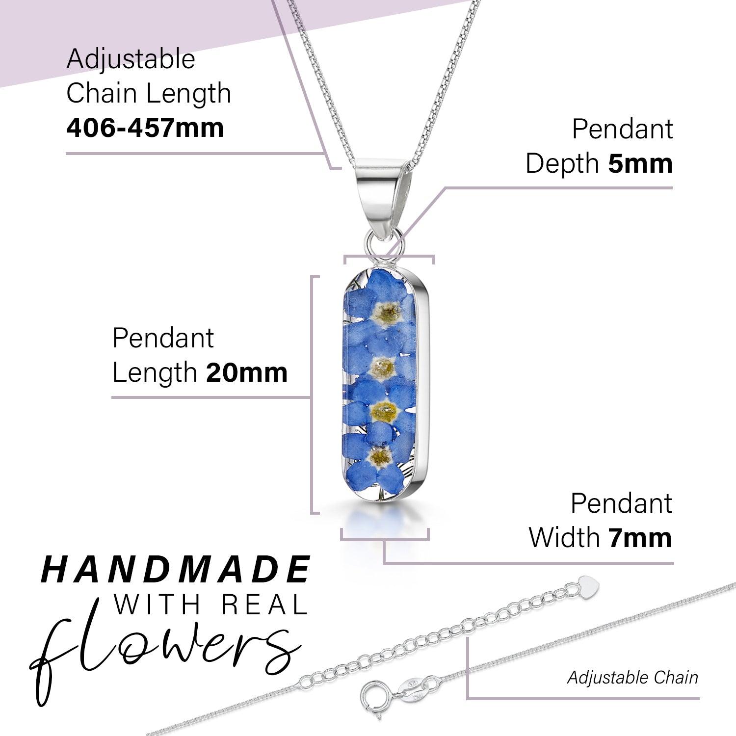 Forget Me Not necklace 'Leela' featuring a vertical bar pendant with real blue flowers encased in resin, on a sterling silver chain.