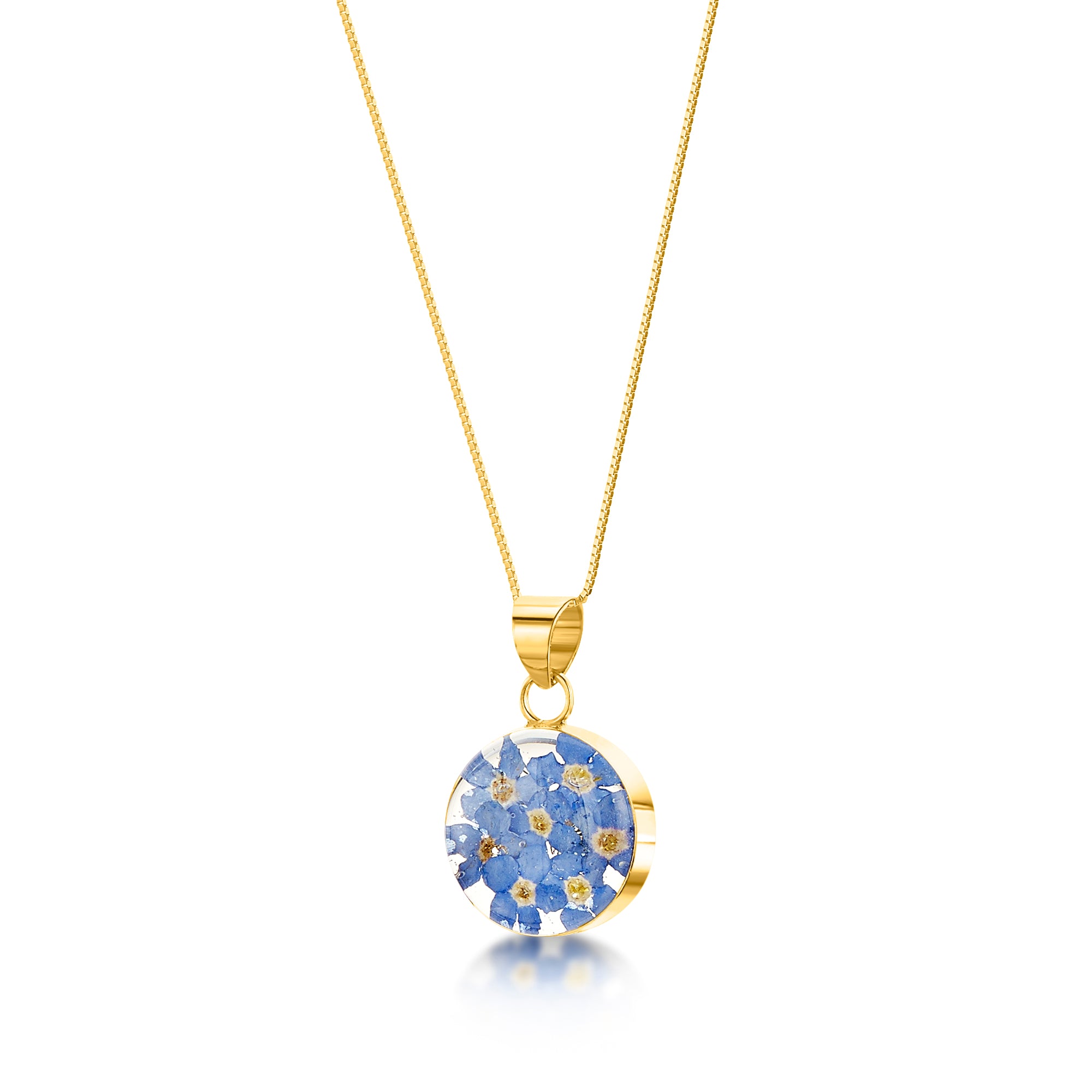 Forget-me-not necklace featuring real flowers in a sterling silver round pendant with an adjustable chain, elegantly presented in a gift box.