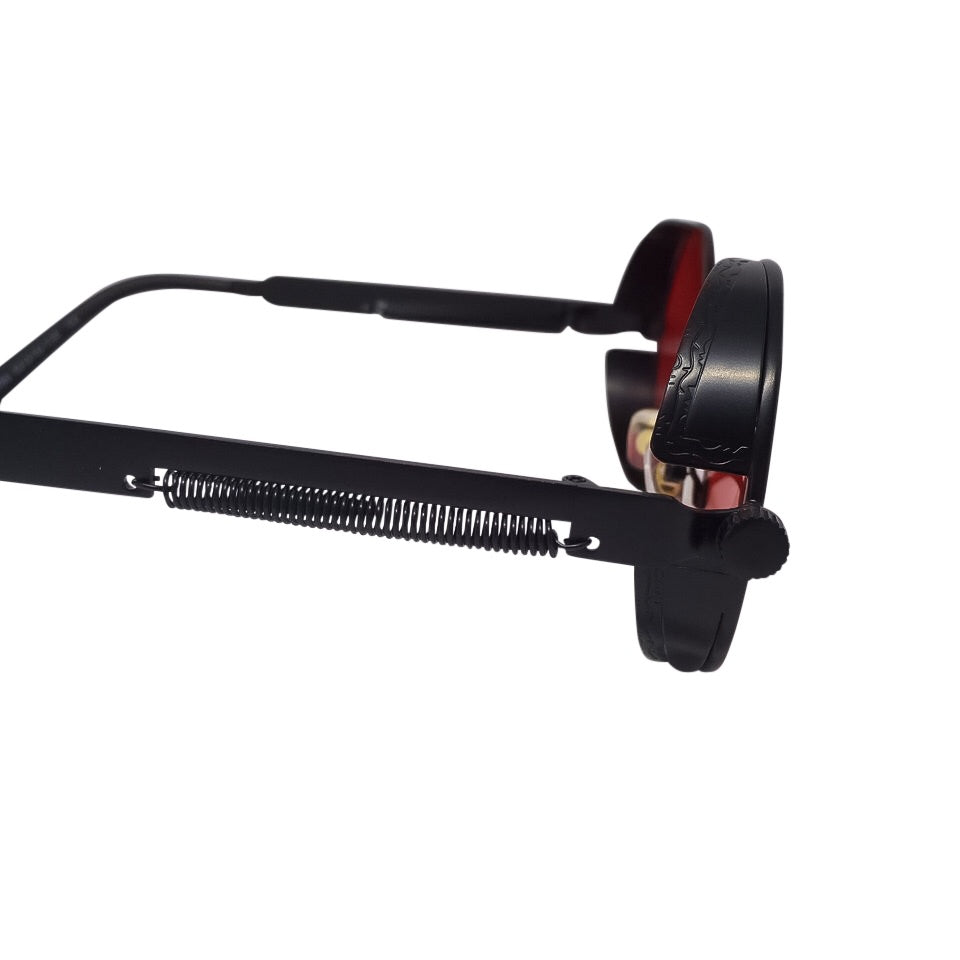 Framed Red x Black Sunglasses showcasing a stylish design with metal and acrylic materials, perfect for unisex wear.