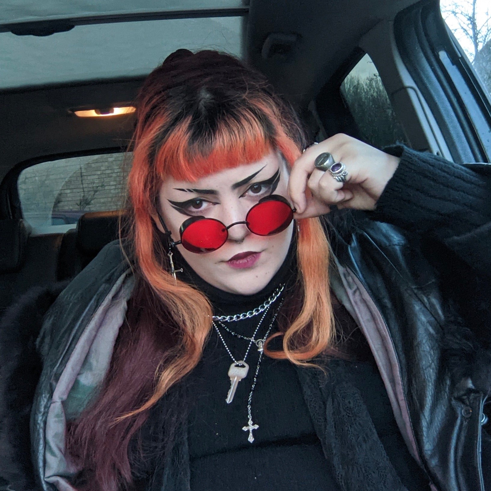 Framed Red x Black Sunglasses showcasing a stylish design with metal and acrylic materials, perfect for unisex wear.