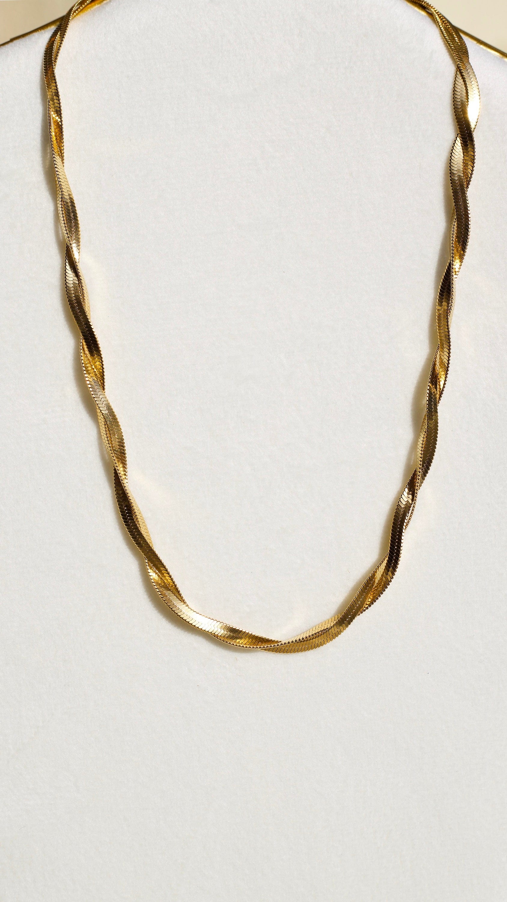 Frances Twisted Snake Chain Necklace in rich gold, showcasing its elegant twisted design and adjustable length.