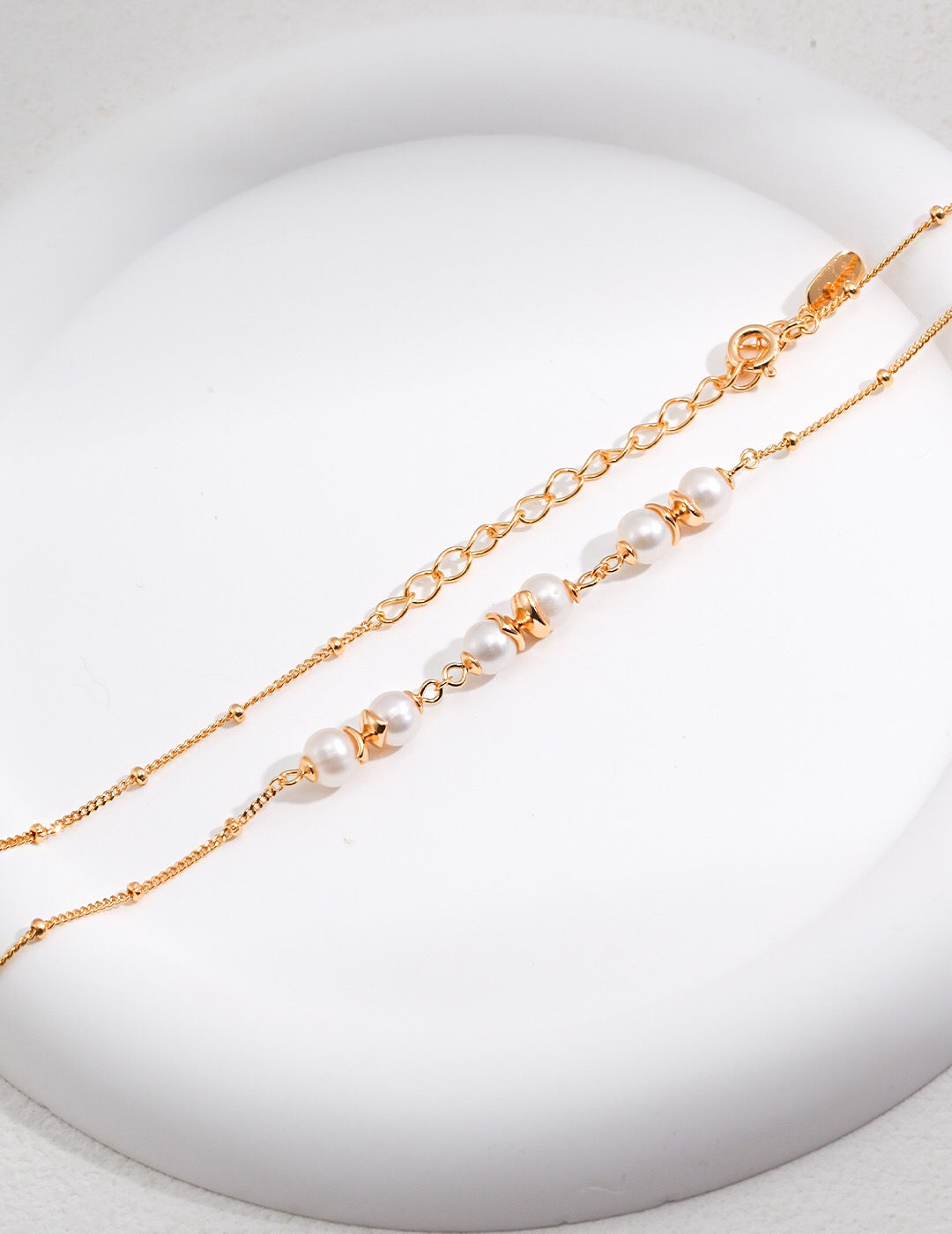 A beautifully handcrafted Freshwater Pearl Beads Spacer Necklace featuring natural pearls and gold vermeil accents, elegantly displayed on a soft background.