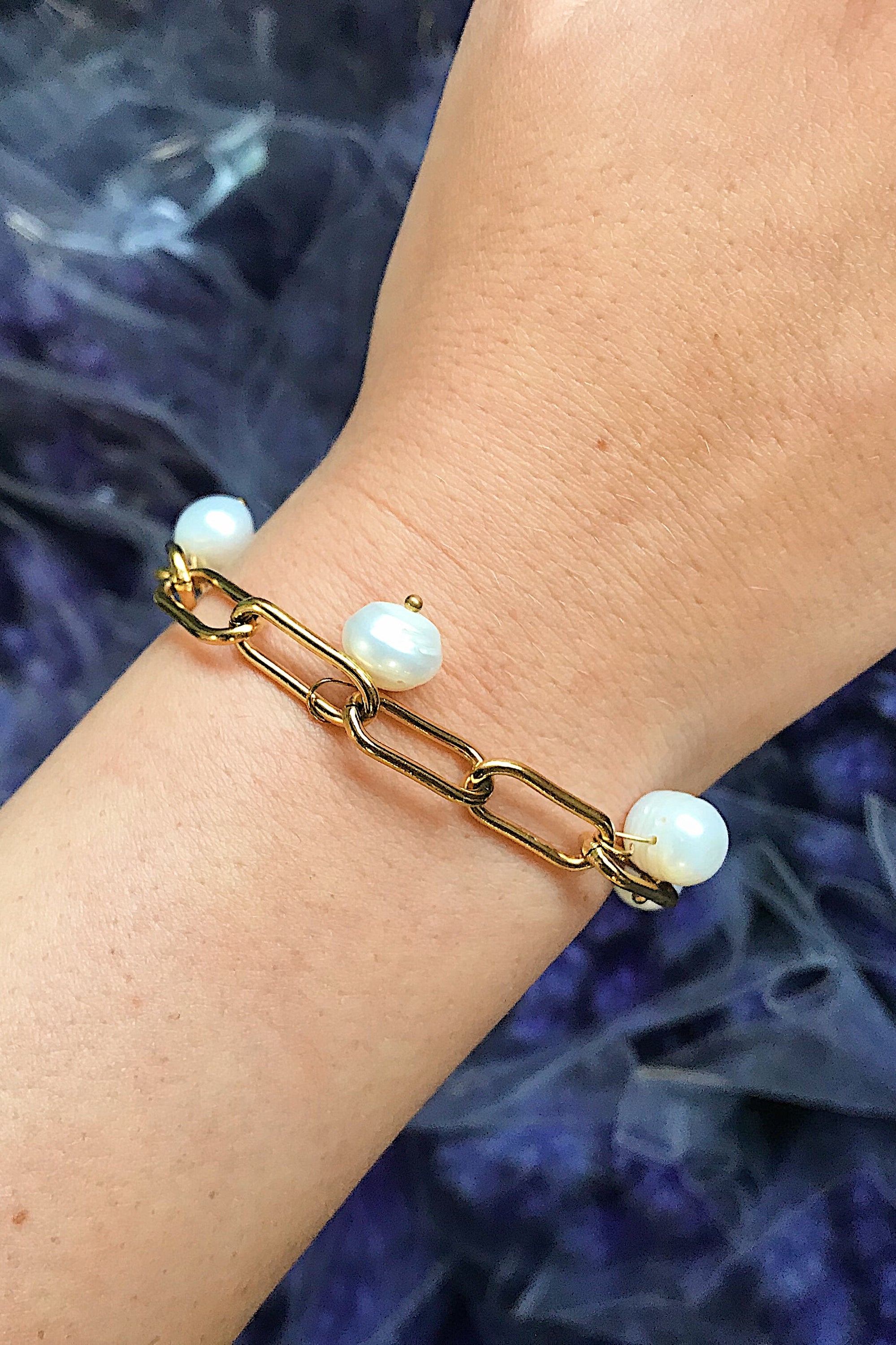 A beautiful Freshwater Pearl Chain Bracelet featuring delicate pearl charms on an adjustable gold-plated stainless steel chain.