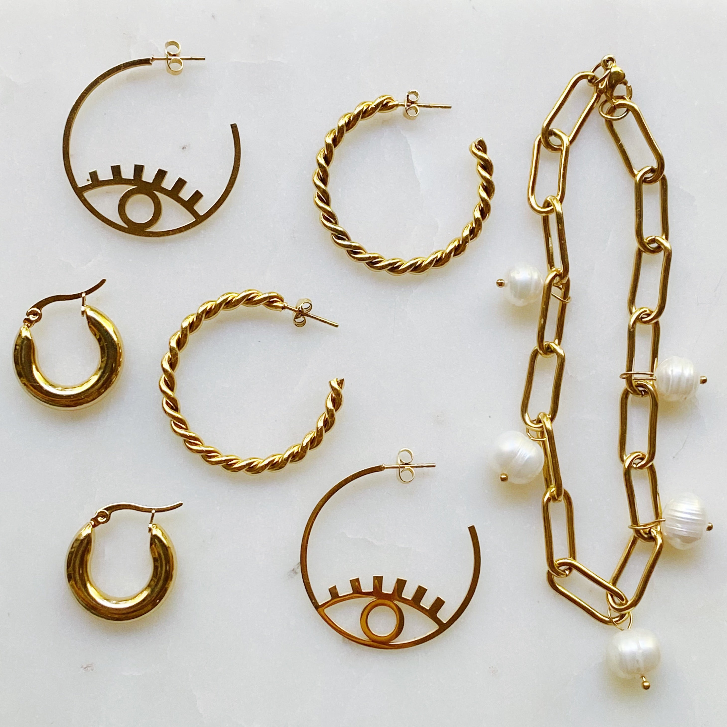 A beautiful Freshwater Pearl Chain Bracelet featuring delicate pearl charms on an adjustable gold-plated stainless steel chain.