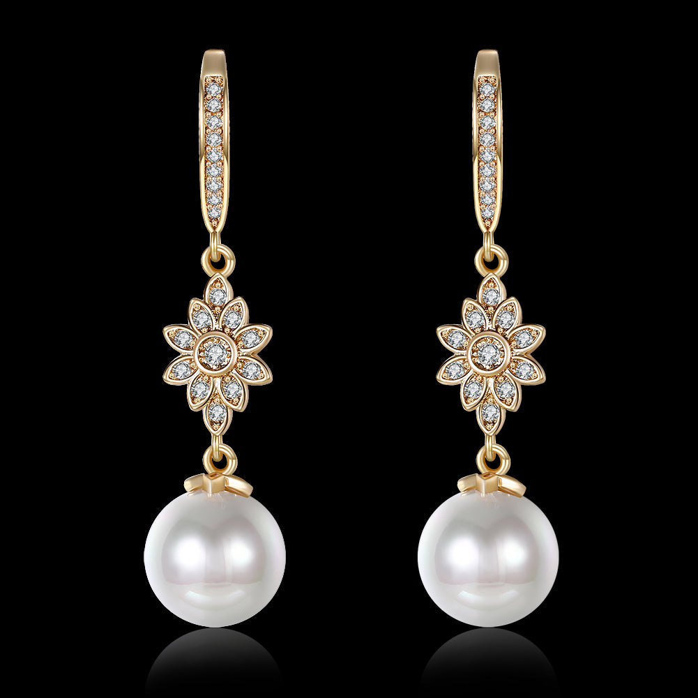 Elegant Freshwater Pearl Starburst Drop Earrings in 18K gold plating, showcasing a luxurious design with hypoallergenic features.