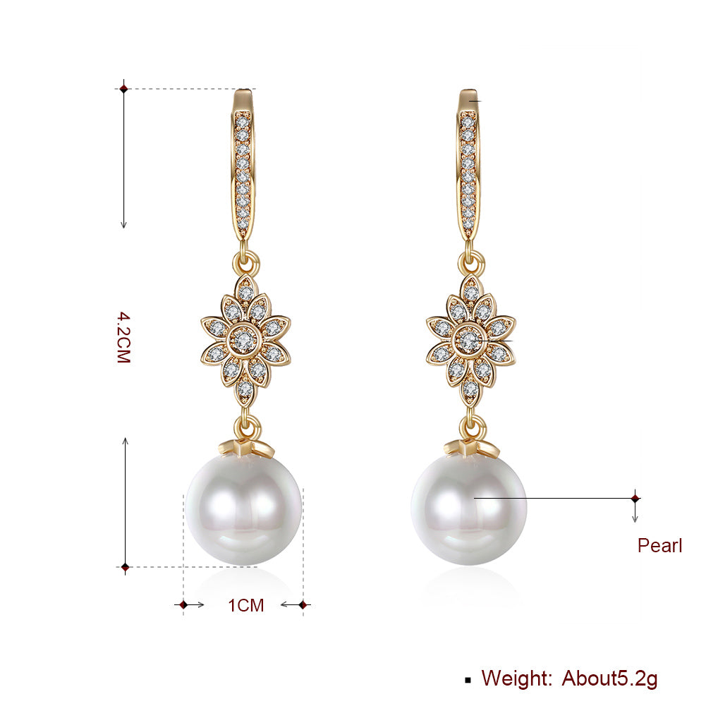Elegant Freshwater Pearl Starburst Drop Earrings in 18K gold plating, showcasing a luxurious design with hypoallergenic features.