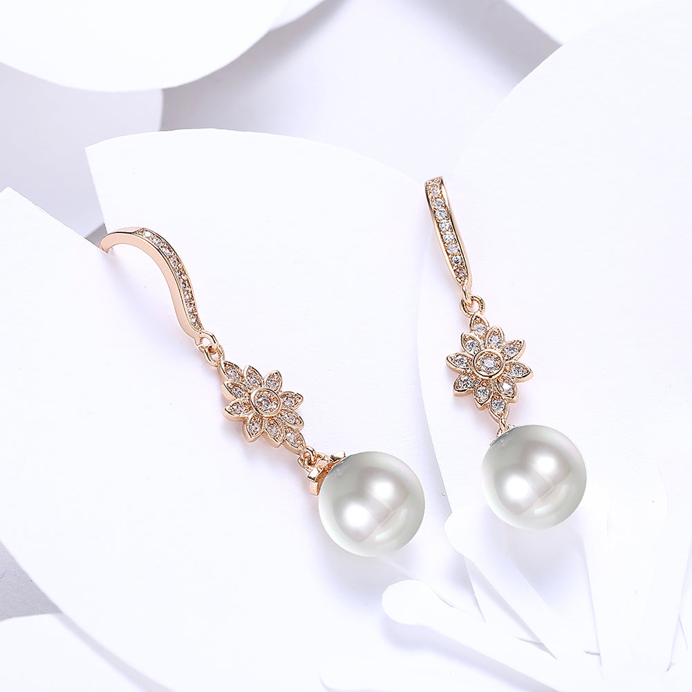 Elegant Freshwater Pearl Starburst Drop Earrings in 18K gold plating, showcasing a luxurious design with hypoallergenic features.