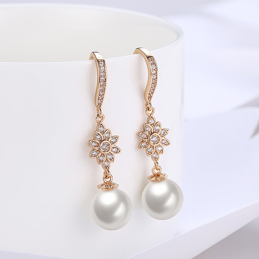 Elegant Freshwater Pearl Starburst Drop Earrings in 18K gold plating, showcasing a luxurious design with hypoallergenic features.