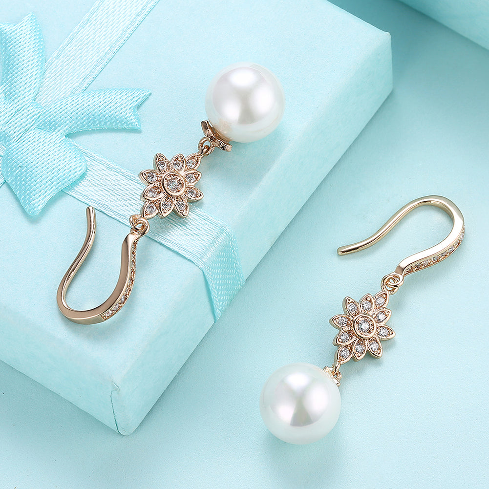 Elegant Freshwater Pearl Starburst Drop Earrings in 18K gold plating, showcasing a luxurious design with hypoallergenic features.