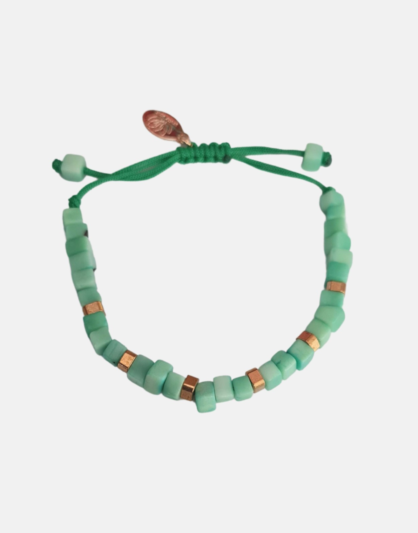 Friendship Tagua Bracelet made from tagua nut with raw brass details, showcasing its unique squares and adjustable fastener.