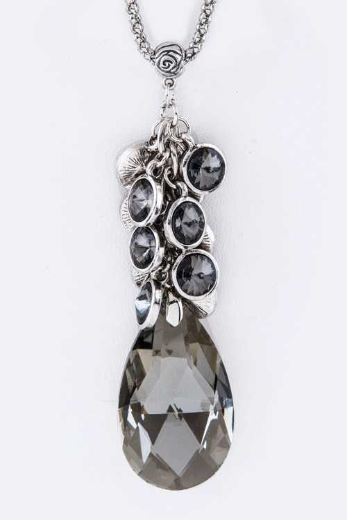 Fringe Crystals & Teardrop Pendant Necklace Set featuring a 28-inch necklace and 1.35-inch drop earrings, showcasing elegant crystal designs.