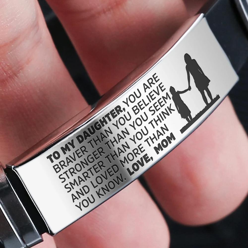 A beautiful steel and silicone bracelet engraved with a heartfelt message from mother to daughter, showcasing its elegant design and premium materials.
