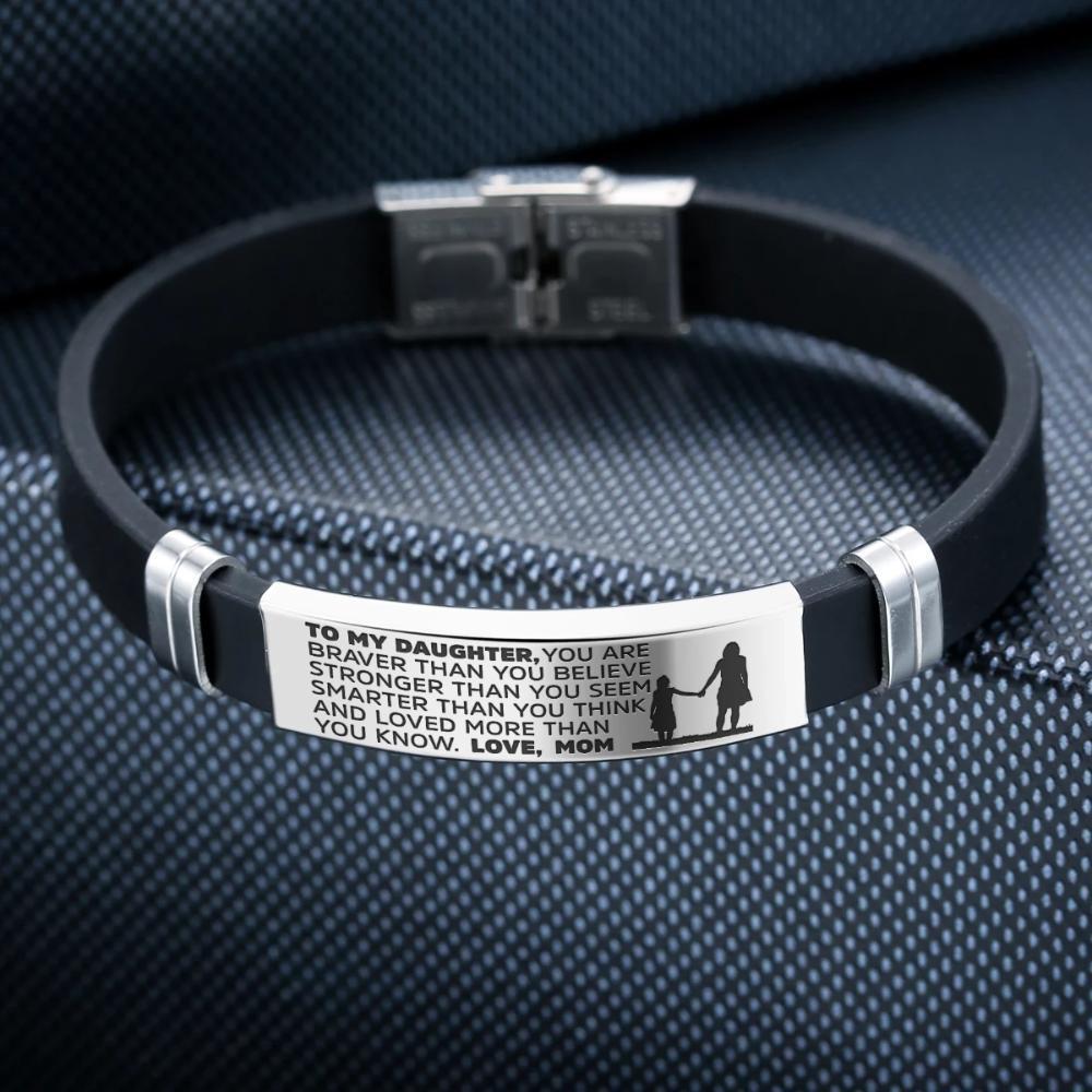 A beautiful steel and silicone bracelet engraved with a heartfelt message from mother to daughter, showcasing its elegant design and premium materials.