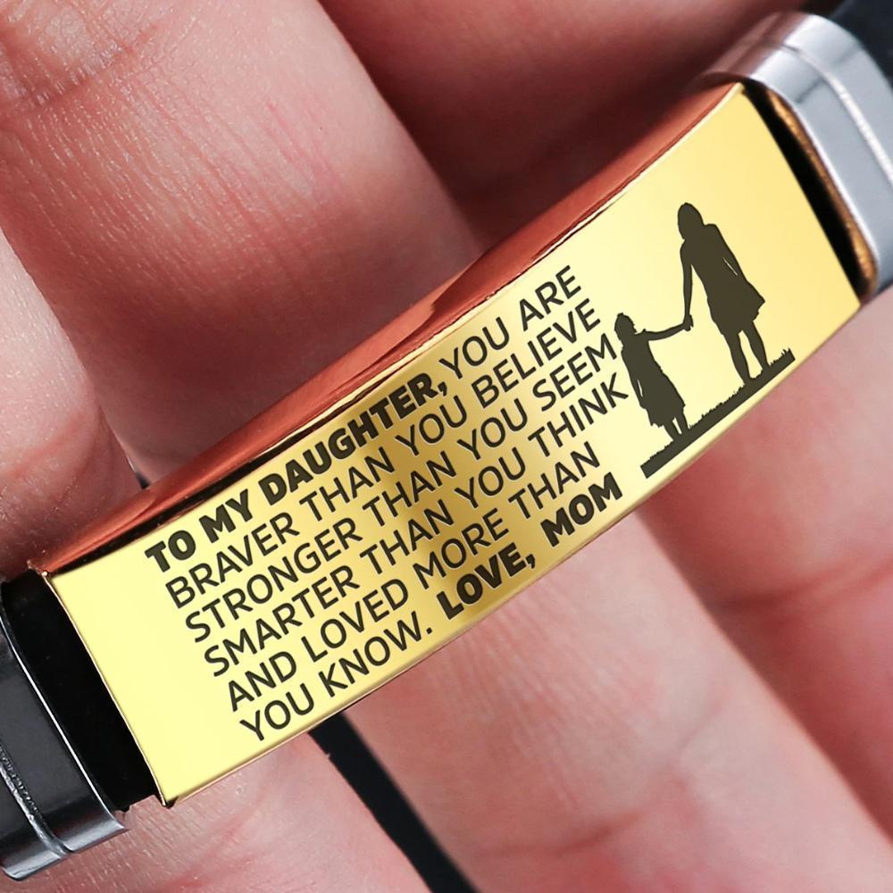 A beautiful steel and silicone bracelet engraved with a heartfelt message from mother to daughter, showcasing its elegant design and premium materials.