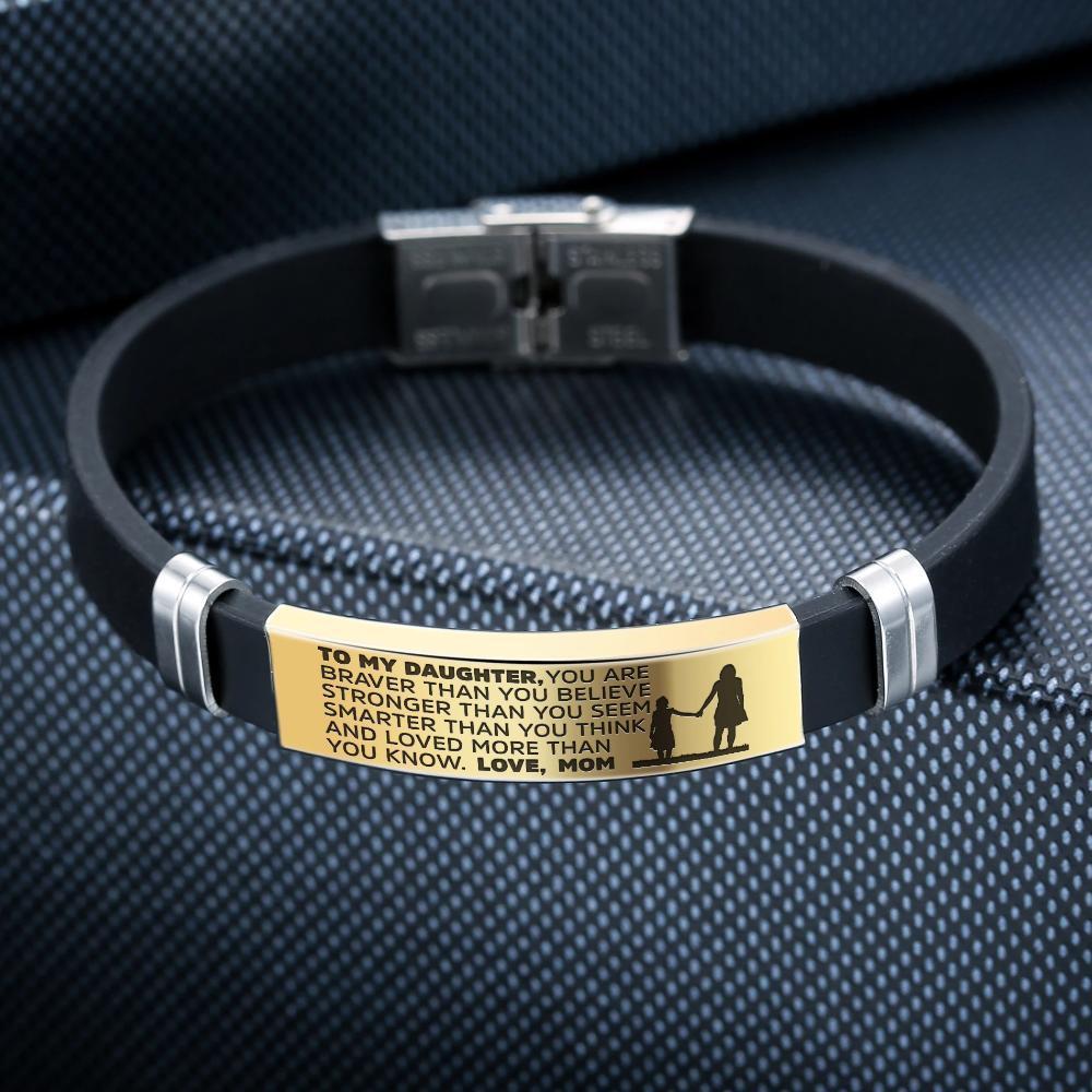 A beautiful steel and silicone bracelet engraved with a heartfelt message from mother to daughter, showcasing its elegant design and premium materials.