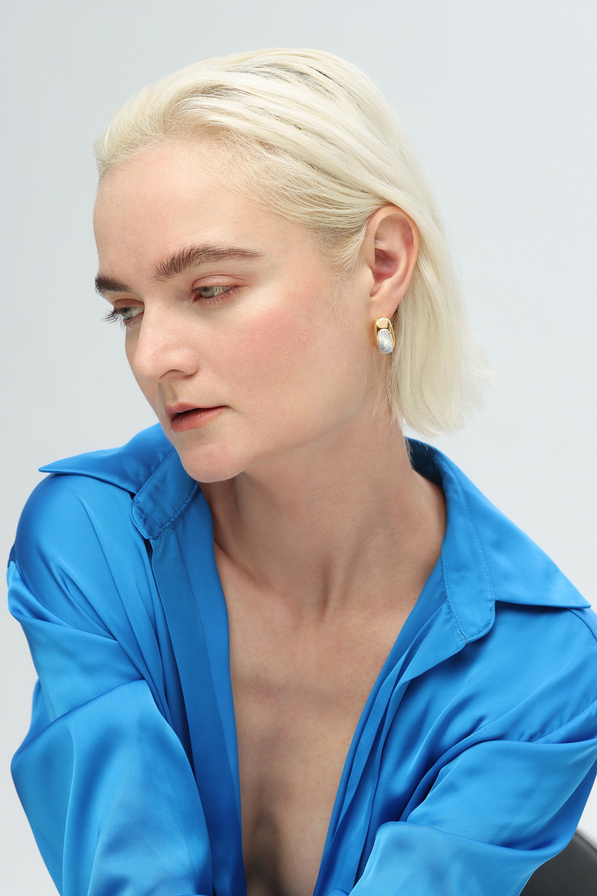 Frosted and Matted Texture Two Tone Hoop Earrings featuring silver nuggets and a gold frame, showcasing a chic and elegant design.