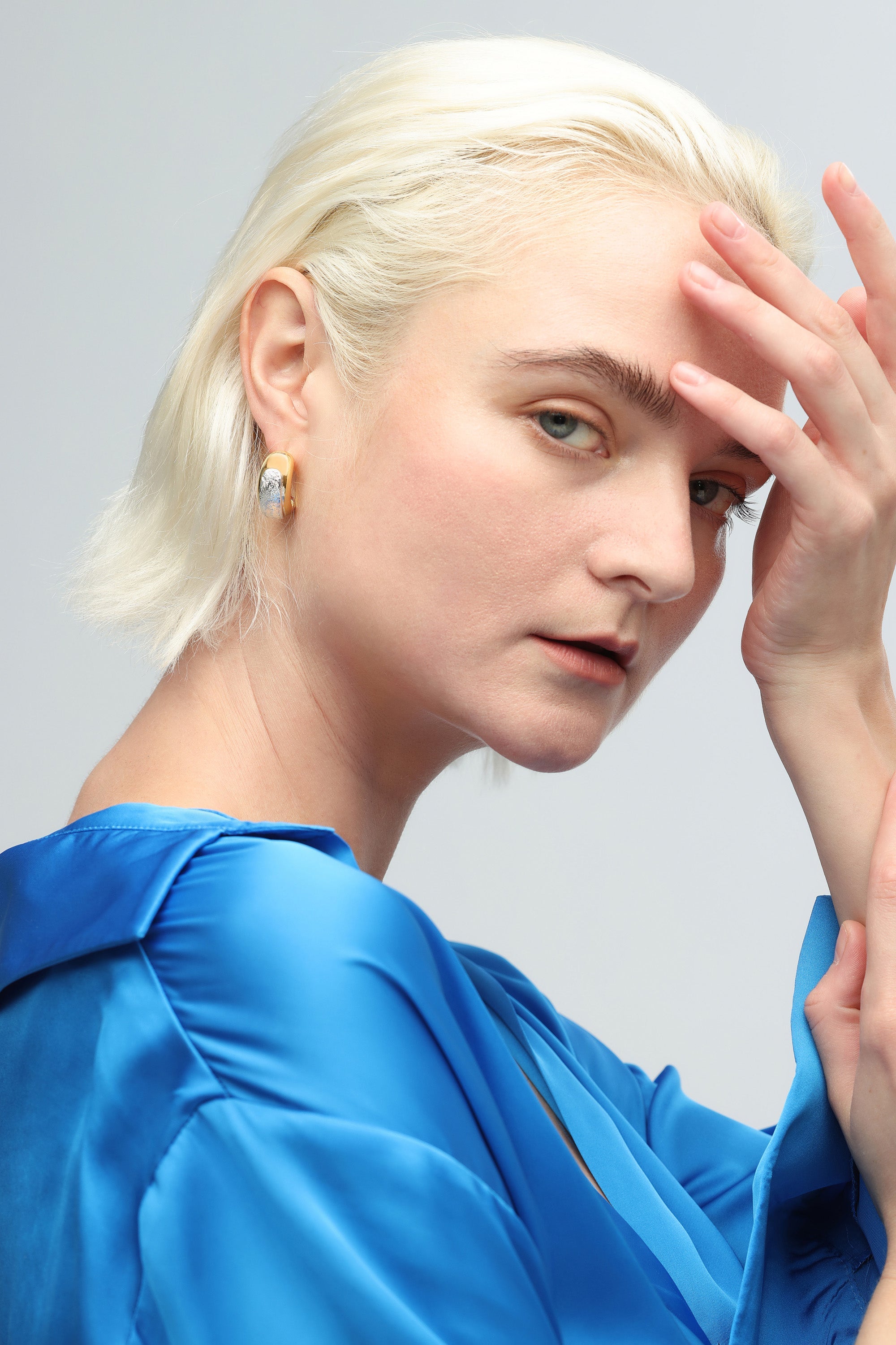 Frosted and Matted Texture Two Tone Hoop Earrings featuring silver nuggets and a gold frame, showcasing a chic and elegant design.