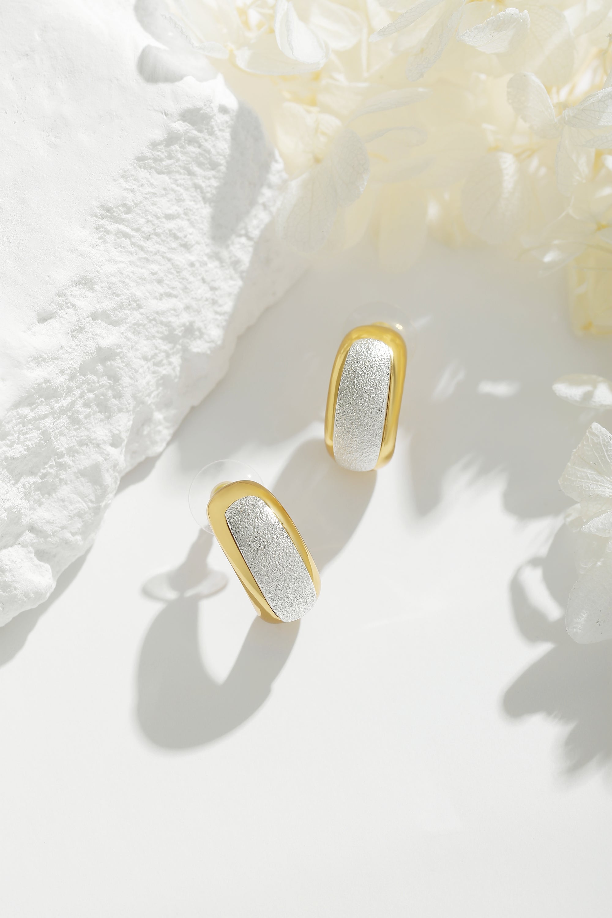 Frosted and Matted Texture Two Tone Hoop Earrings featuring silver nuggets and a gold frame, showcasing a chic and elegant design.