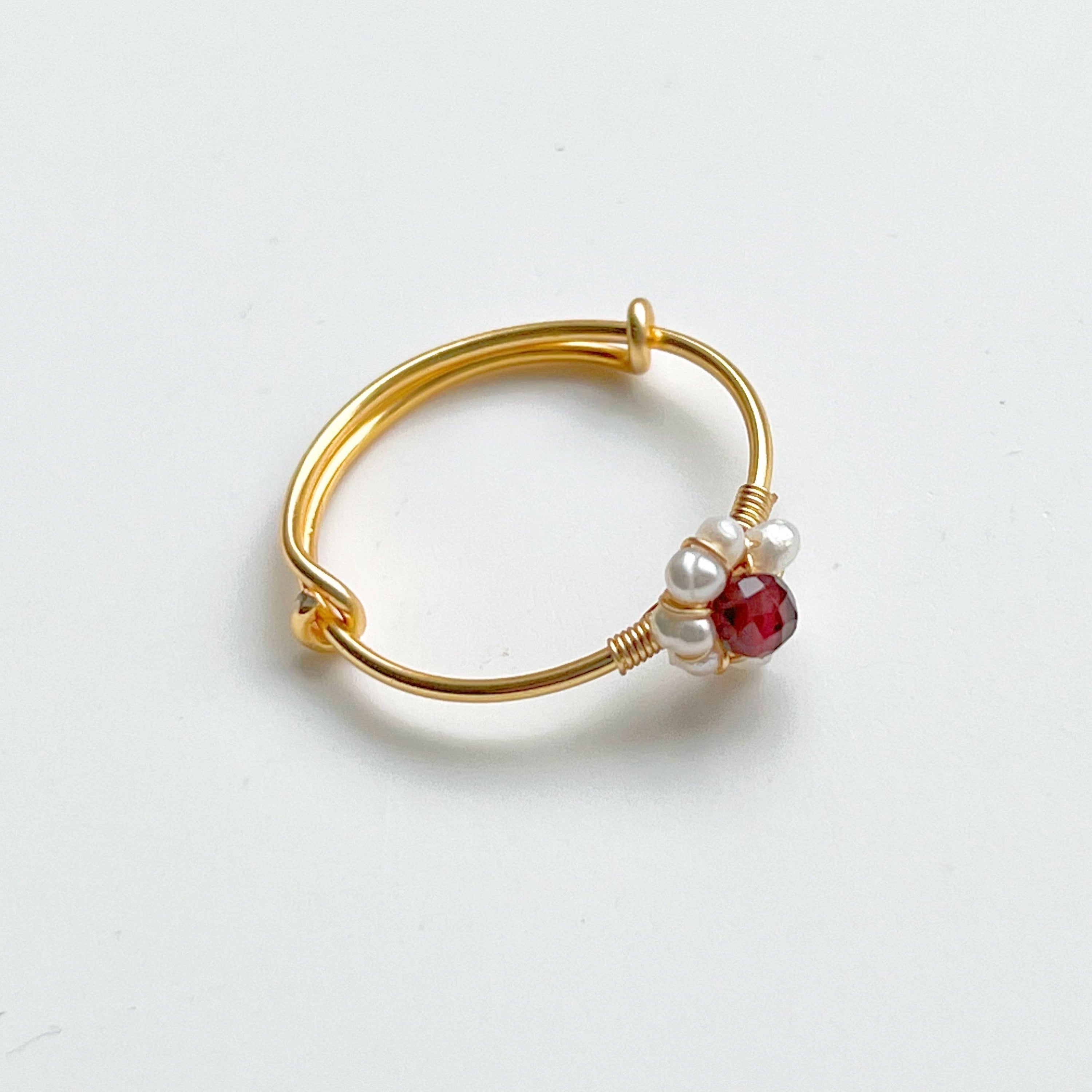 Garnet and Pearl Beads Adjustable Ring showcasing red garnet and white pearl beads on a gold-plated bronze band.