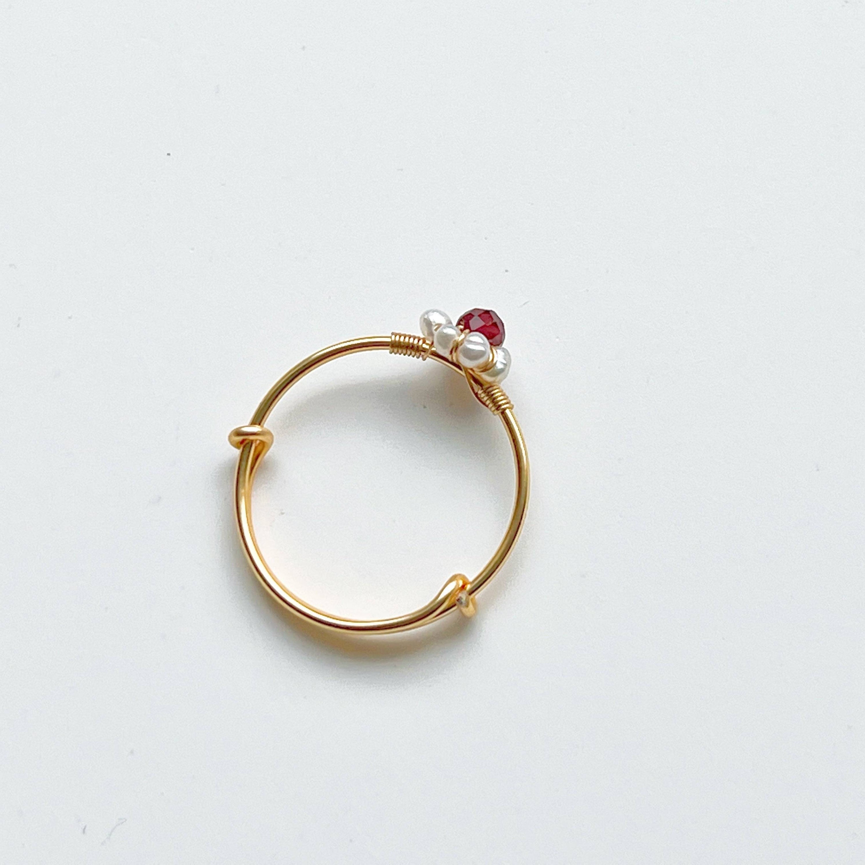 Garnet and Pearl Beads Adjustable Ring showcasing red garnet and white pearl beads on a gold-plated bronze band.