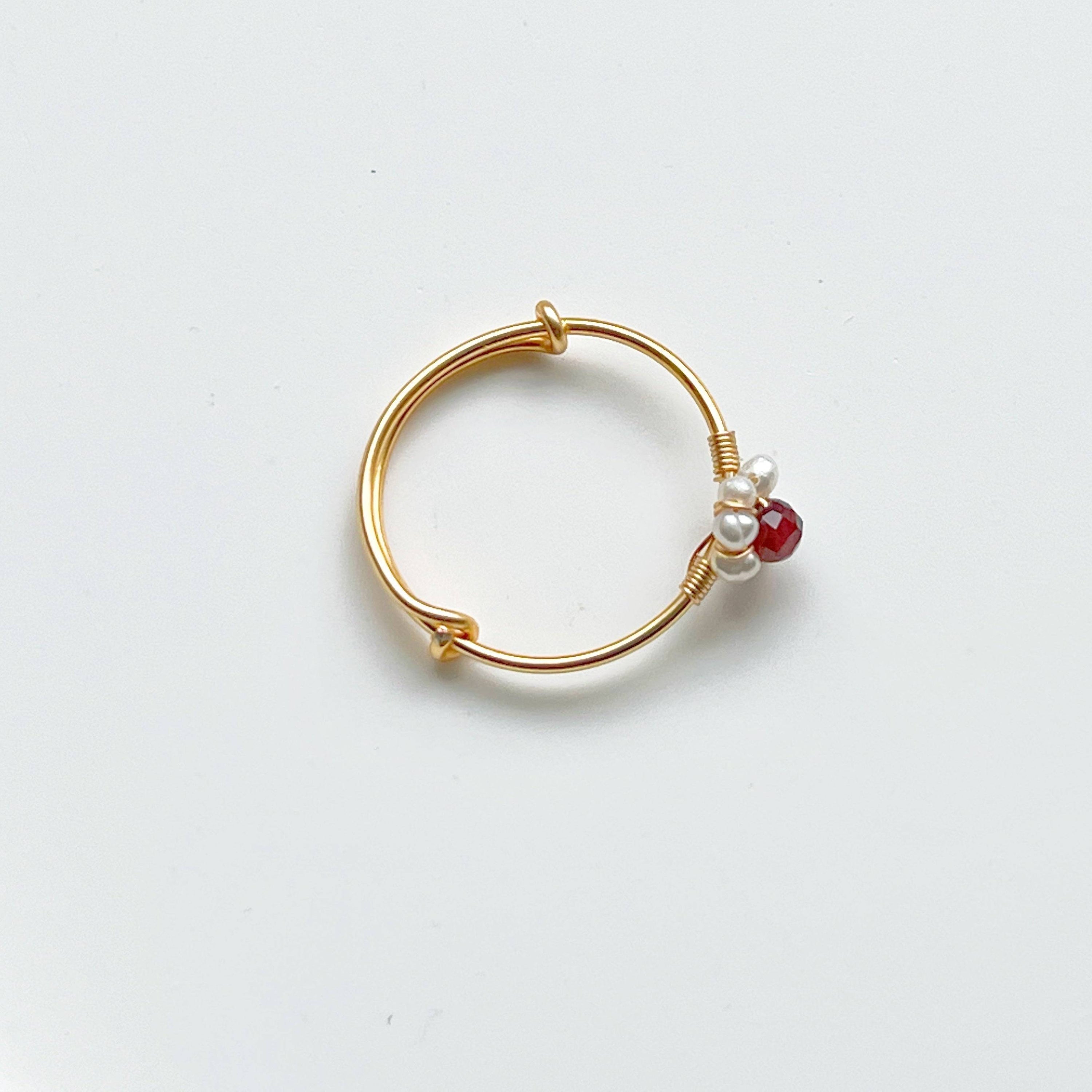 Garnet and Pearl Beads Adjustable Ring showcasing red garnet and white pearl beads on a gold-plated bronze band.