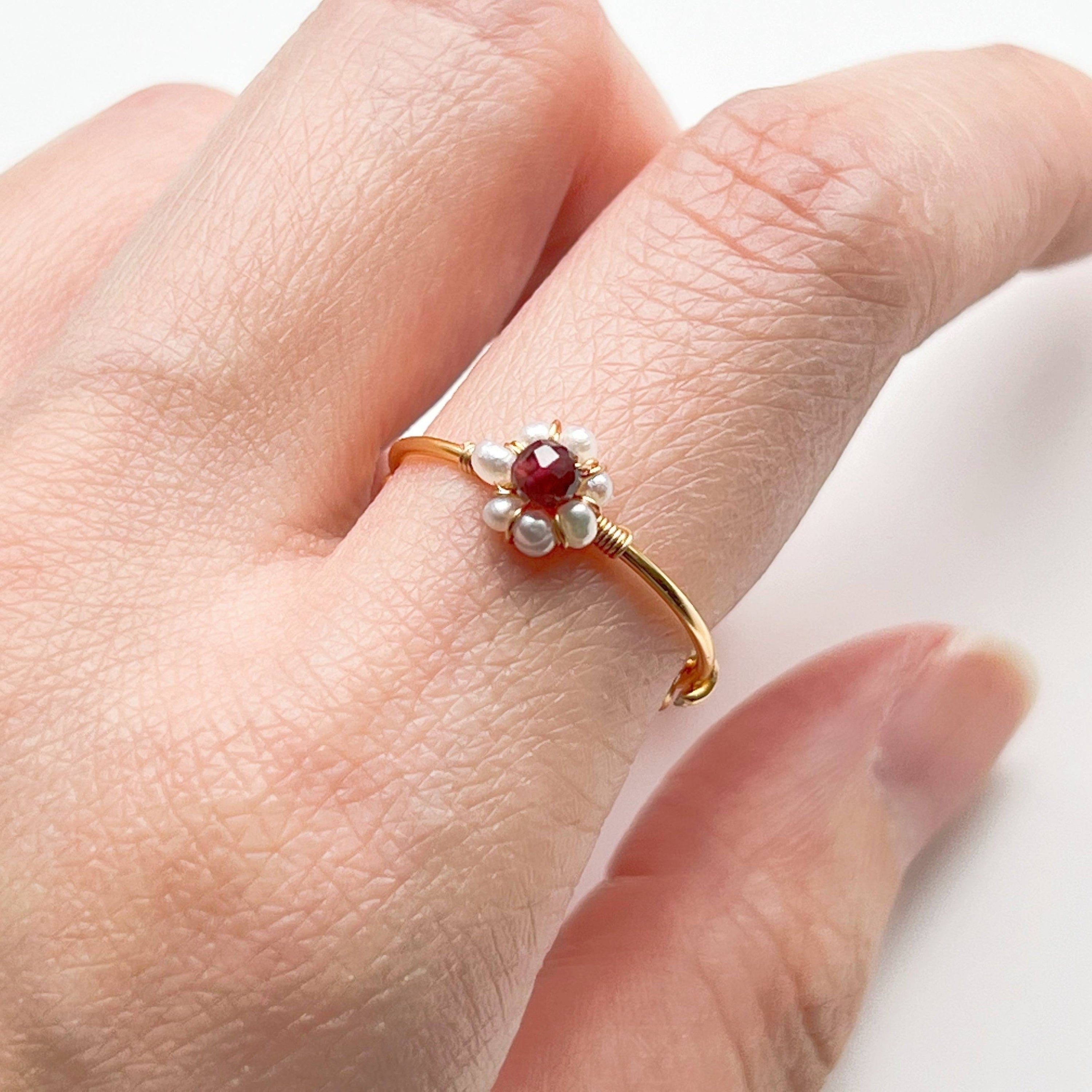 Garnet and Pearl Beads Adjustable Ring showcasing red garnet and white pearl beads on a gold-plated bronze band.