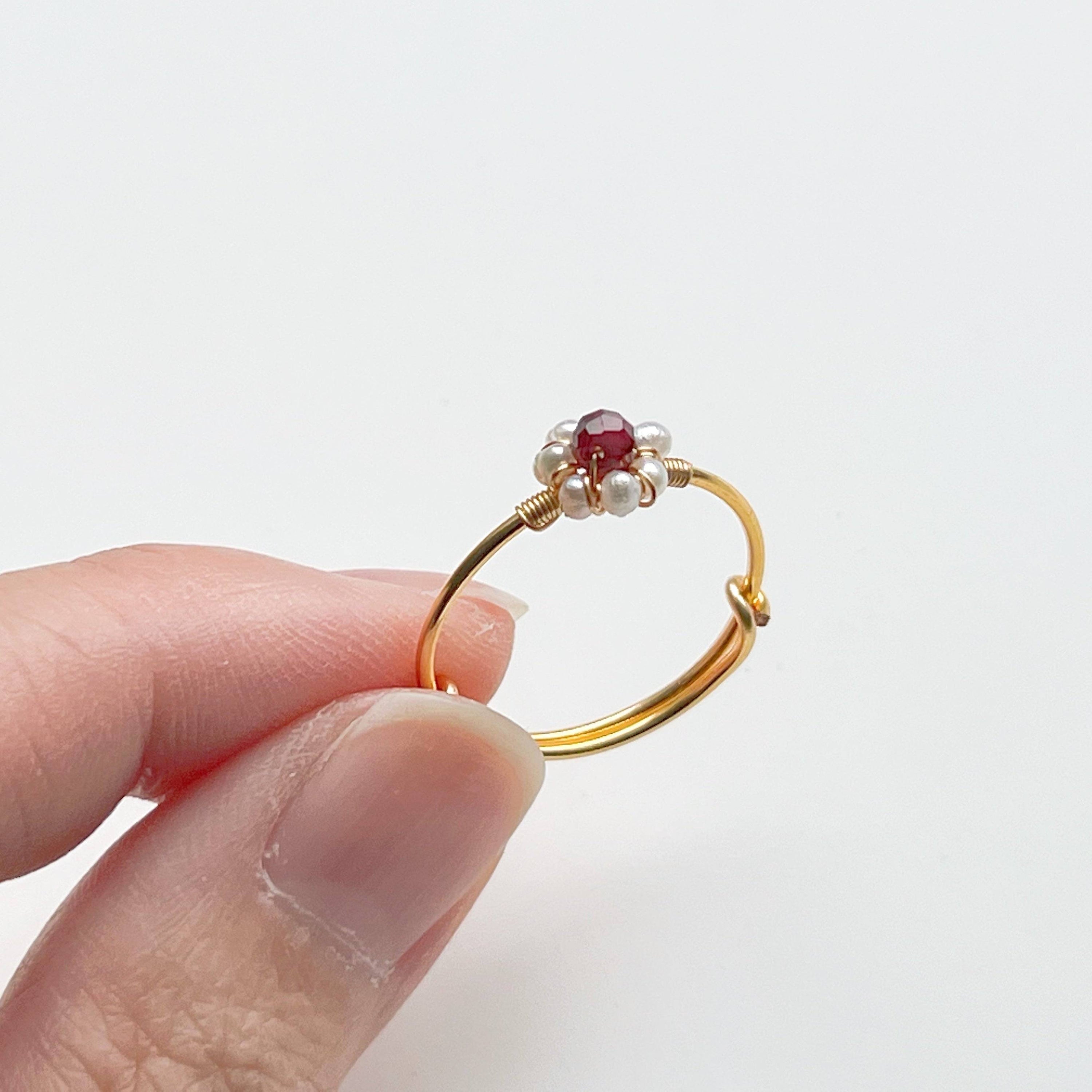 Garnet and Pearl Beads Adjustable Ring showcasing red garnet and white pearl beads on a gold-plated bronze band.