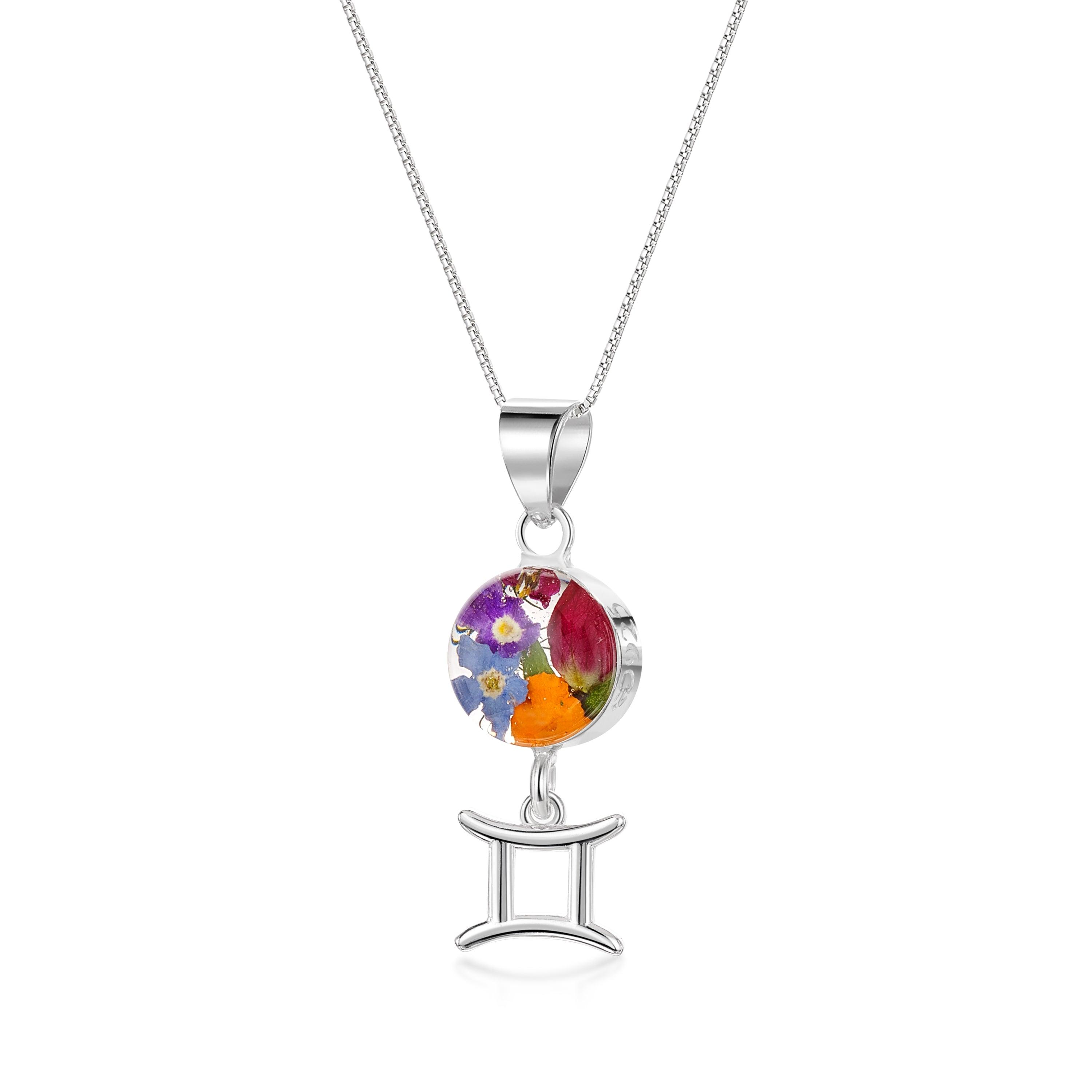 Gemini Necklace featuring a sterling silver pendant with real preserved flowers and a zodiac charm, showcasing elegance and individuality.