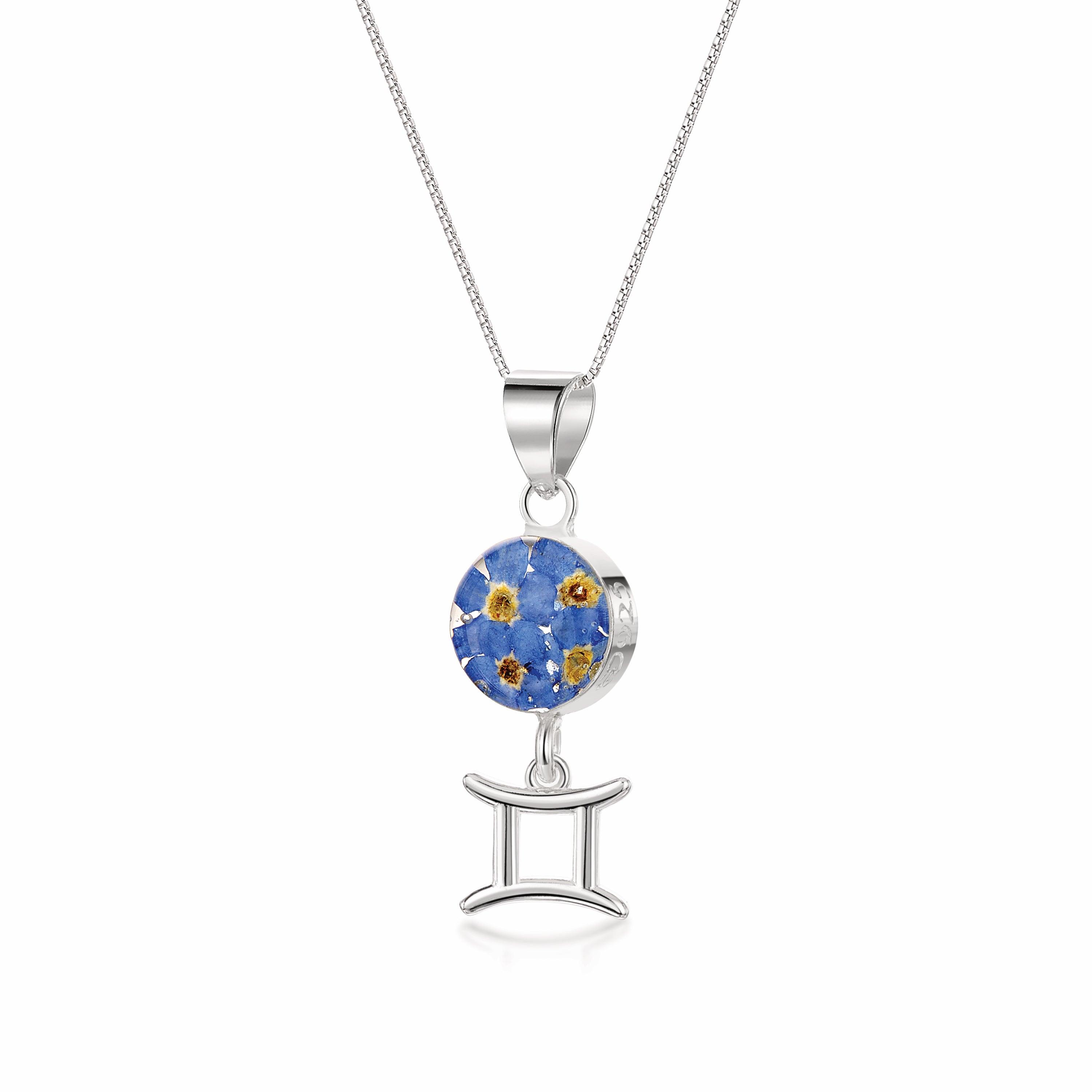 Gemini Necklace featuring a sterling silver pendant with real preserved flowers and a zodiac charm, showcasing elegance and individuality.