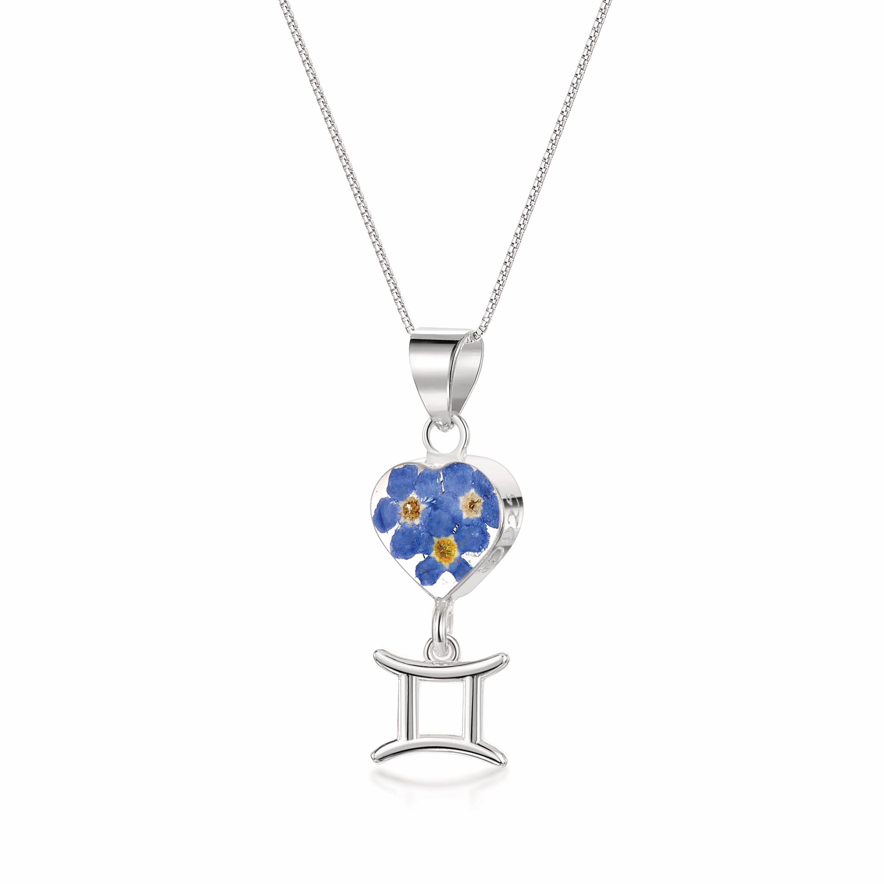Gemini Necklace featuring a sterling silver pendant with real preserved flowers and a zodiac charm, showcasing elegance and individuality.