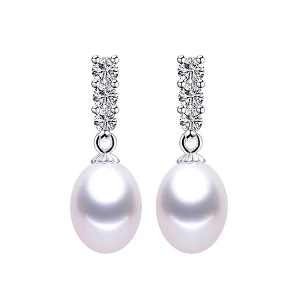 A pair of elegant drop earrings featuring genuine freshwater pearls in various colors, adorned with simulated diamonds for added sparkle.