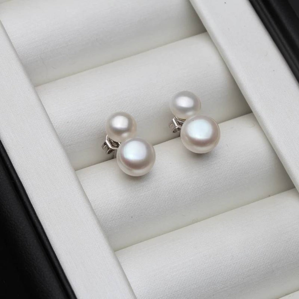 A pair of Genuine Freshwater Pearl Double Drop Earrings featuring elegant black and white pearls, showcasing their unique luster and design.