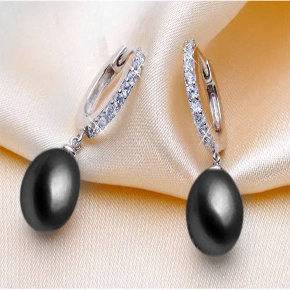 Elegant drop earrings featuring genuine freshwater pearls and simulated diamonds, available in multiple colors.