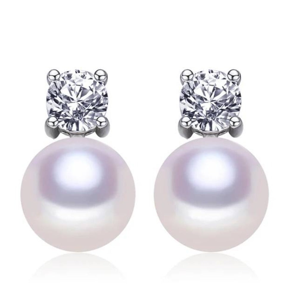 A pair of elegant stud earrings featuring genuine freshwater pearls and simulated diamond accents, available in various colors.