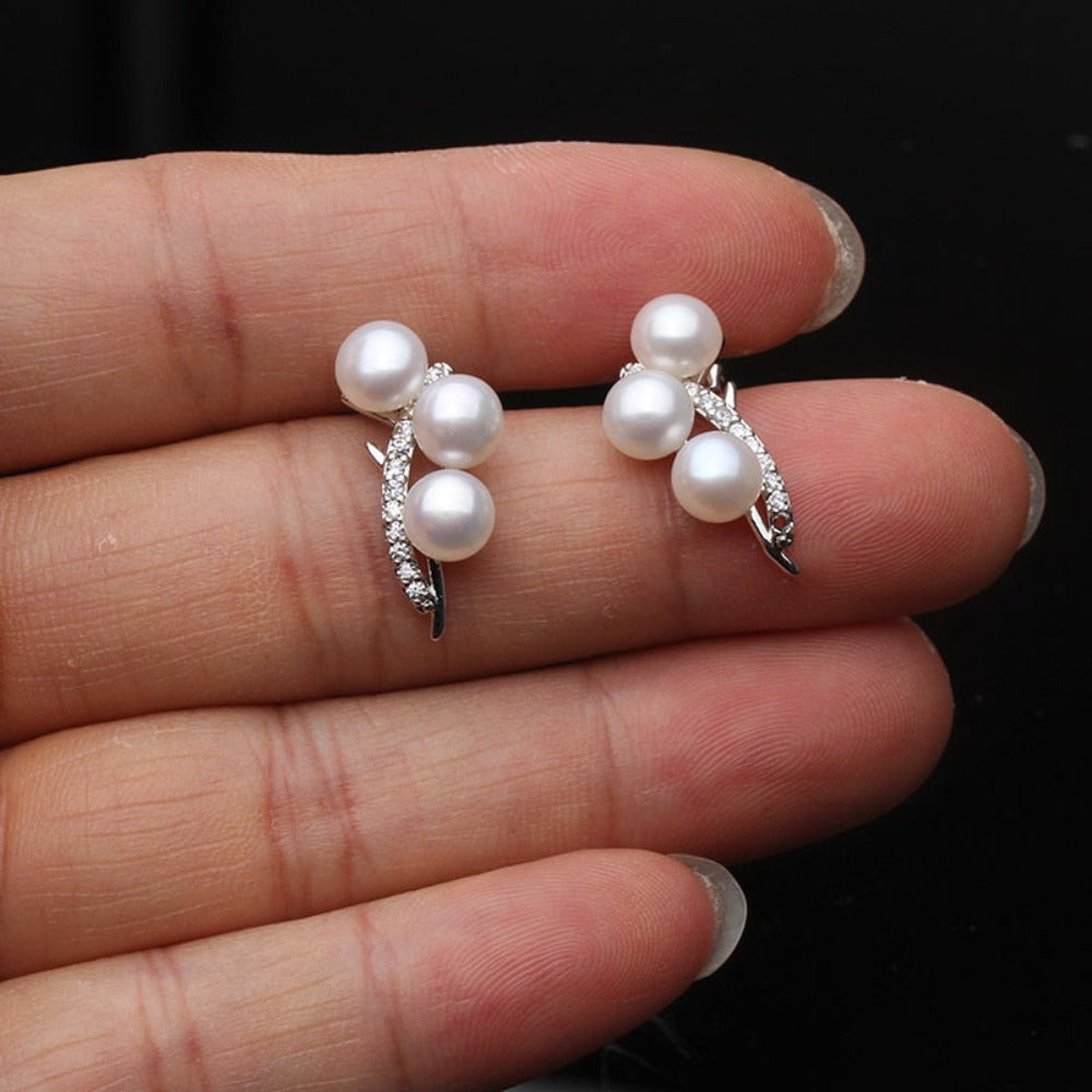 Elegant Genuine Triple Freshwater Pearl and Simulated Diamond Stud Earrings showcasing three pearls and sparkling accents.