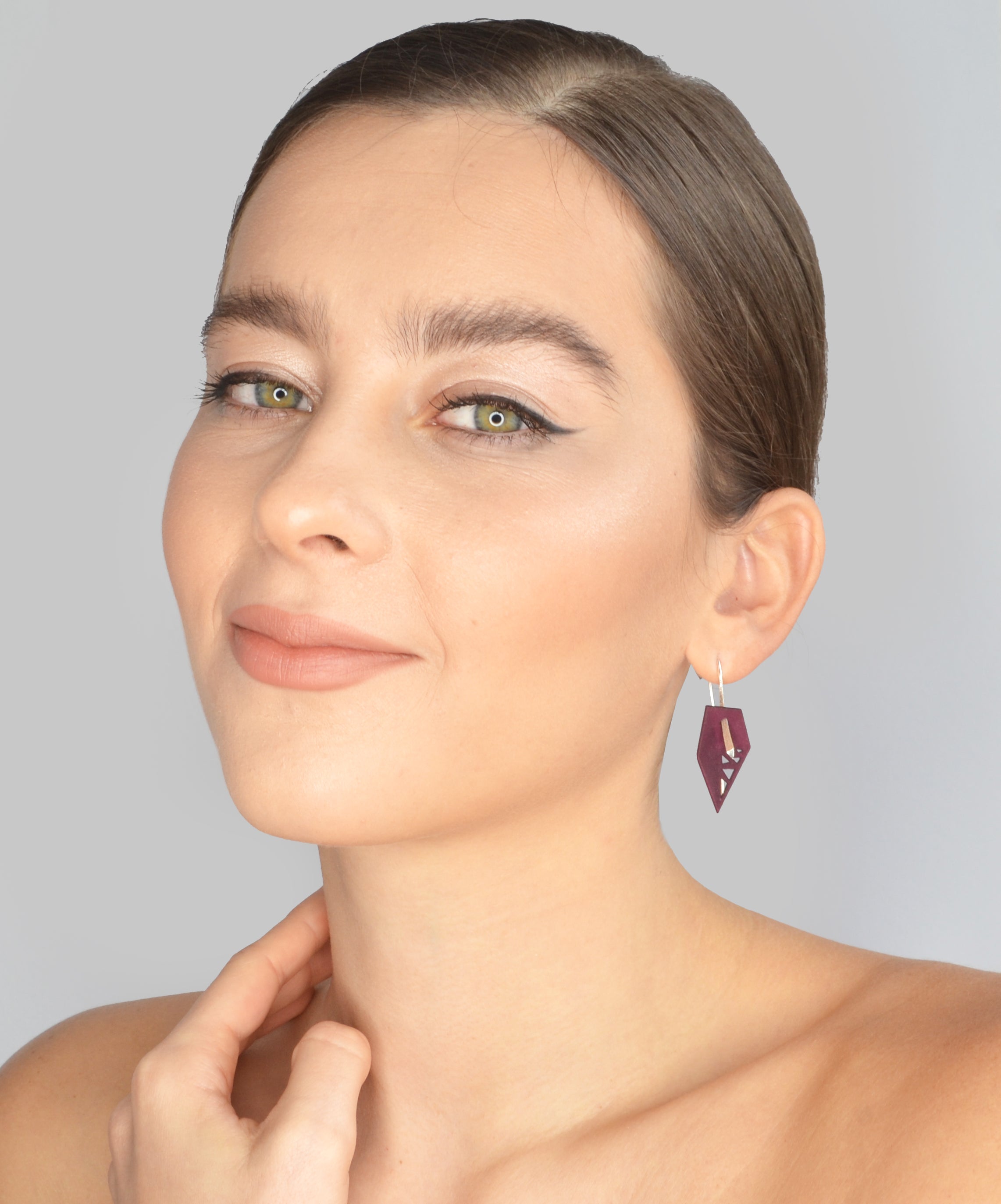 A pair of vibrant Geometric Drop Interchangeable Earrings in various colors, showcasing their unique teardrop design and lightweight structure.