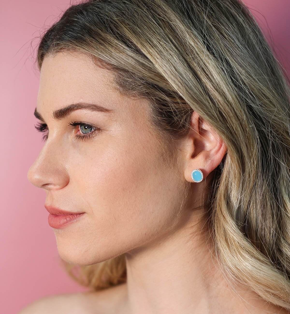 Elegant Glamour oval stud earrings featuring colorful cabochon stones and sparkling accents, available in various metal finishes.